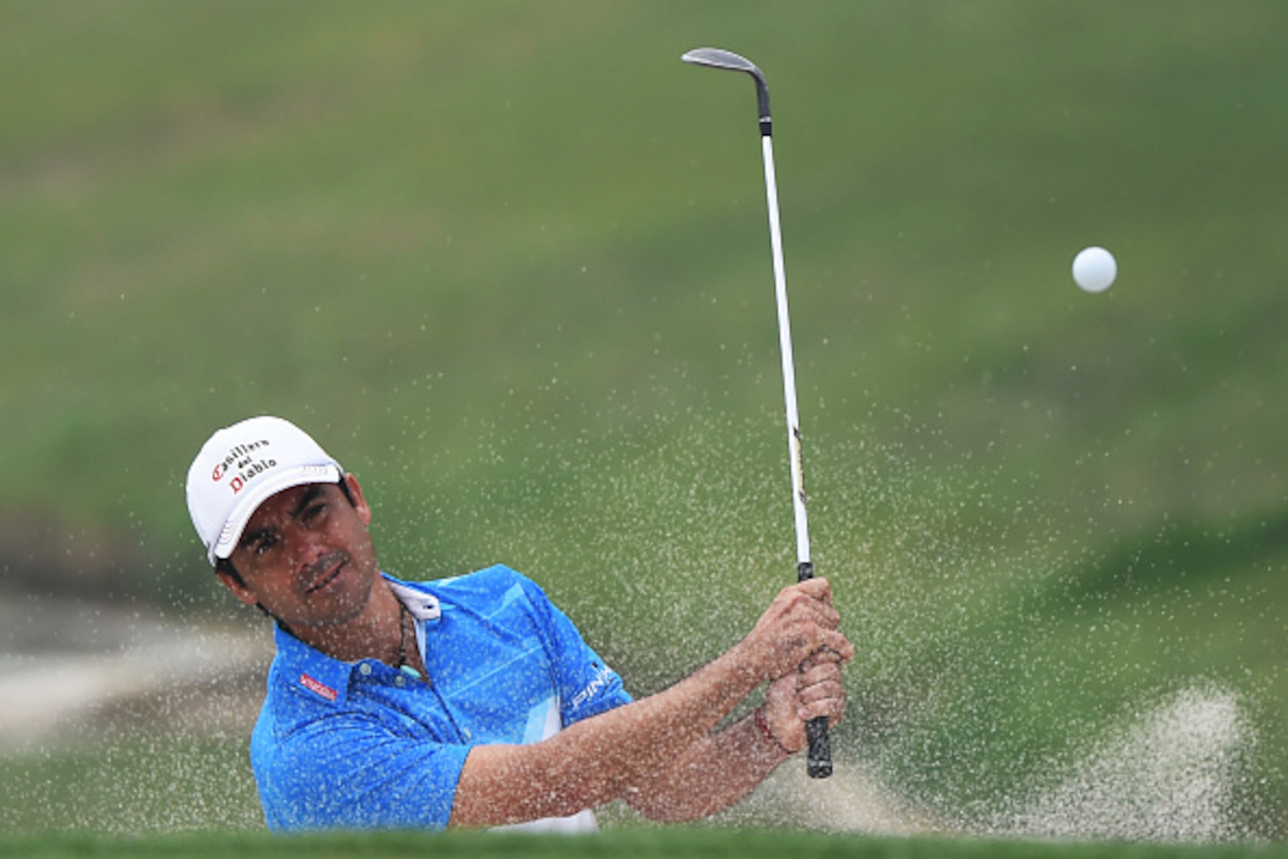 Felipe Aguilar of Chile hits a shot during the final round of the Volvo China Open golf tournament in Beijing on May 1, 2016. / AFP / GREG BAKER        (Photo credit should read GREG BAKER/AFP/Getty Images)