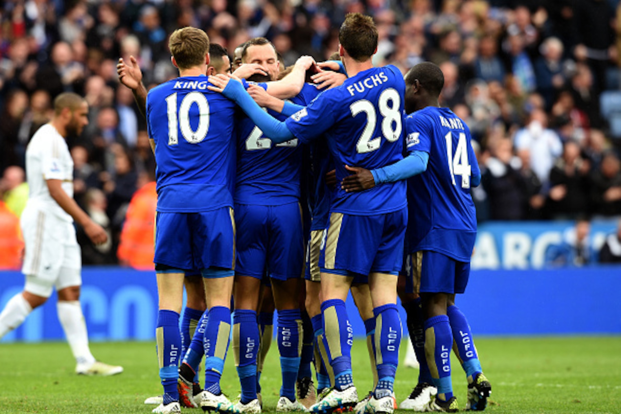 LEICESTER, ENGLAND - APRIL 24:  Marc Albrighton of Leicester City (obscured) celebrates with team mates as he scores their fourth goal during the Barclays Premier League match between Leicester City and Swansea City at The King Power Stadium on April 24, 
