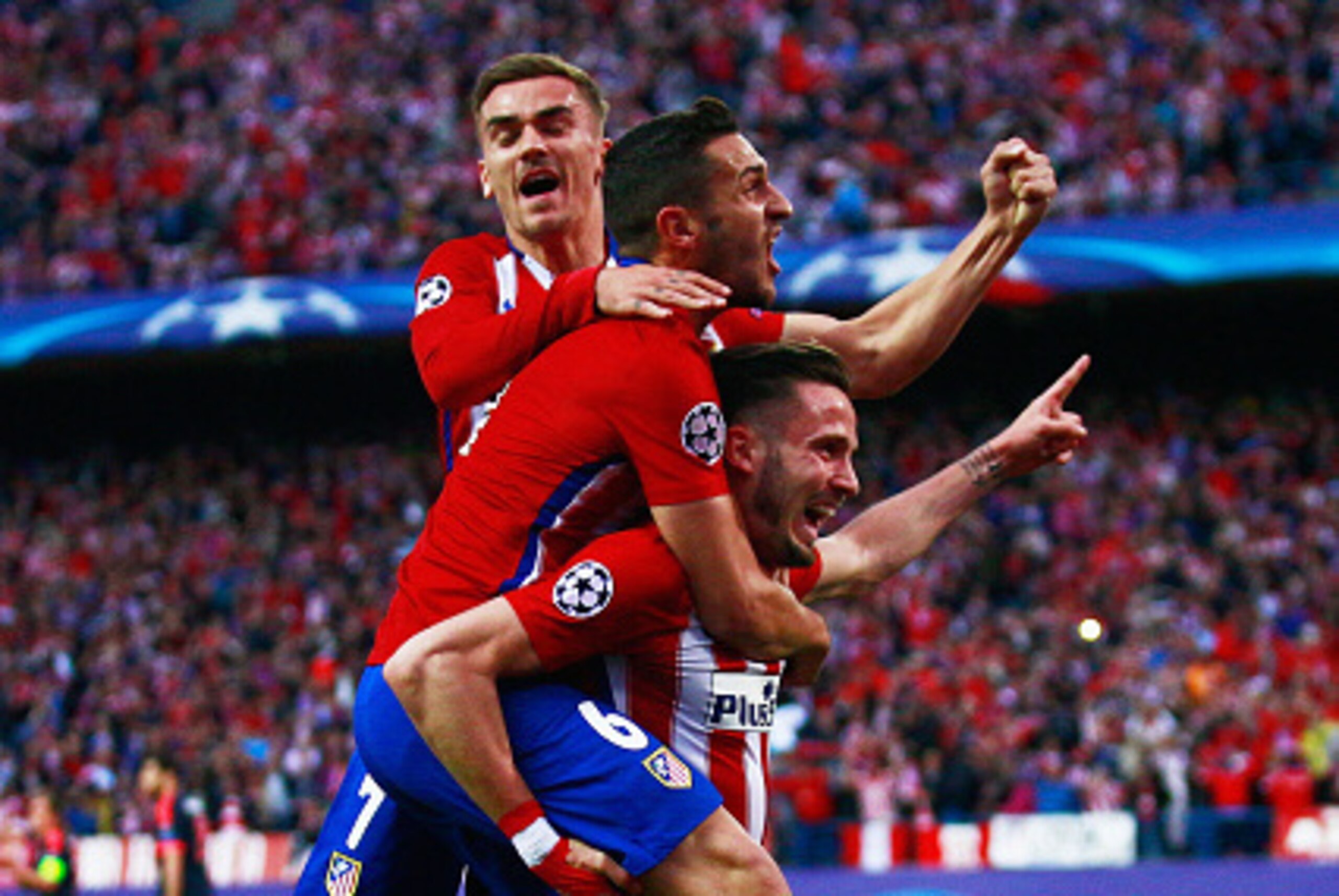 MADRID, SPAIN - APRIL 27:  Saul Niguez of Atletico Madrid (R) celebrates with team mates Antoine Griezmann (L) and Koke (C) as he scores their first goal during the UEFA Champions League semi final first leg match between Club Atletico de Madrid and FC Ba
