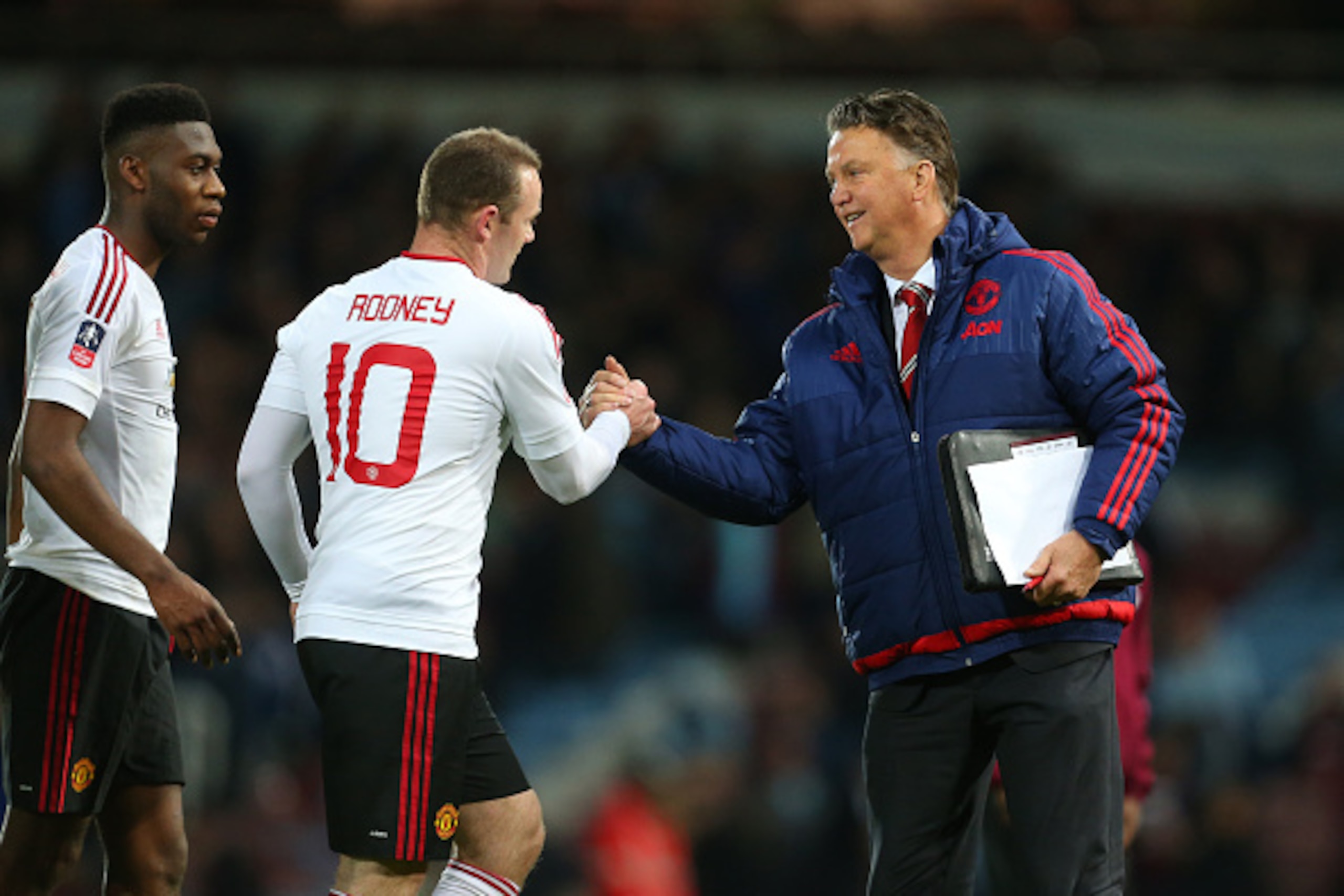 LONDON, ENGLAND - APRIL 13: Louis van Gaal Manager of Manchester United shakes hands with Wayne Rooney of Manchester United after the Emirates FA Cup Sixth Round Replay match between West Ham United and Manchester United at Boleyn Ground on April 13, 2016