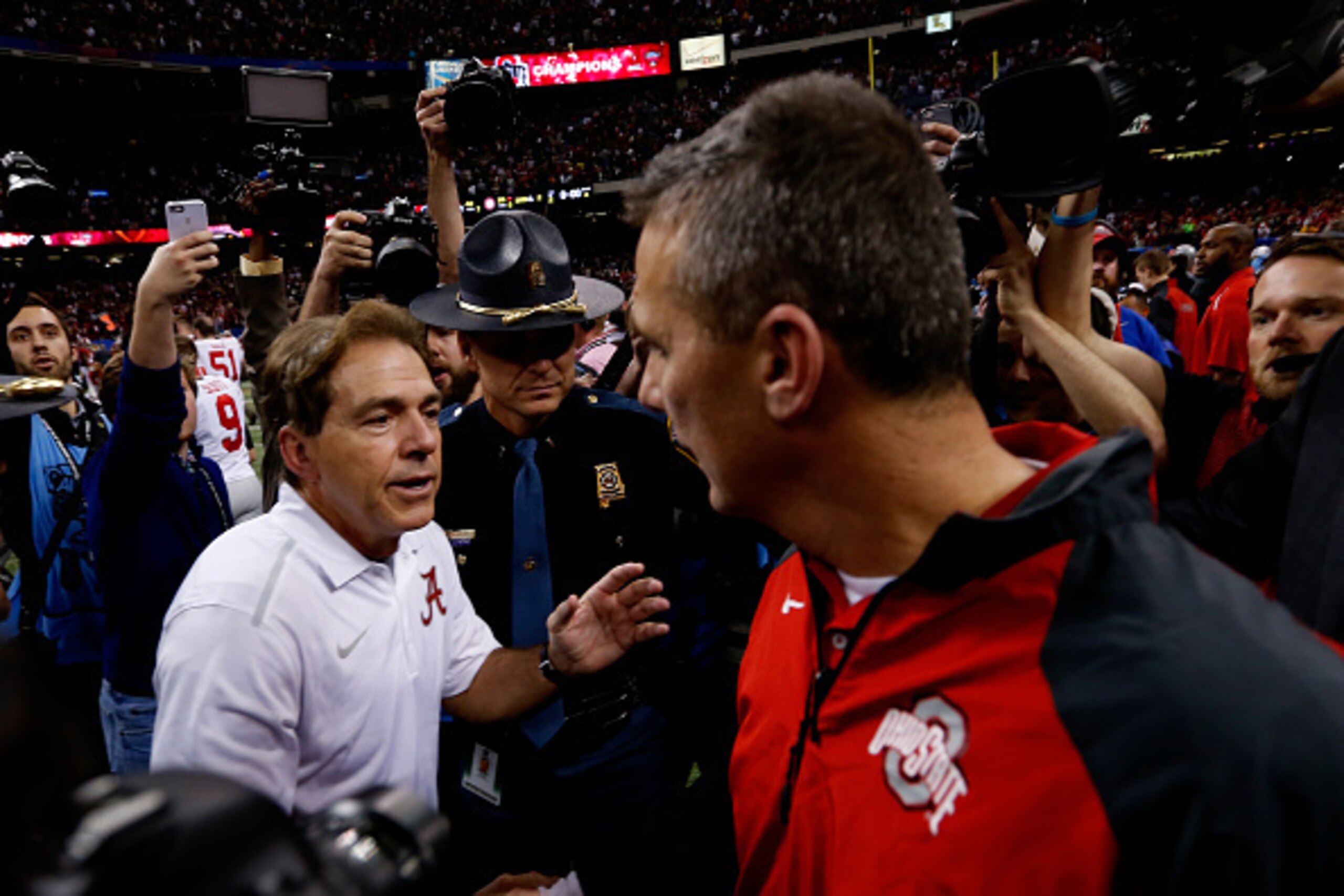 NEW ORLEANS, LA - JANUARY 01:  Head coach Urban Meyer (R) of the Ohio State Buckeyes shakes hands with head coach Nick Saban (L) of the Alabama Crimson Tide  after the All State Sugar Bowl at the Mercedes-Benz Superdome on January 1, 2015 in New Orleans, 