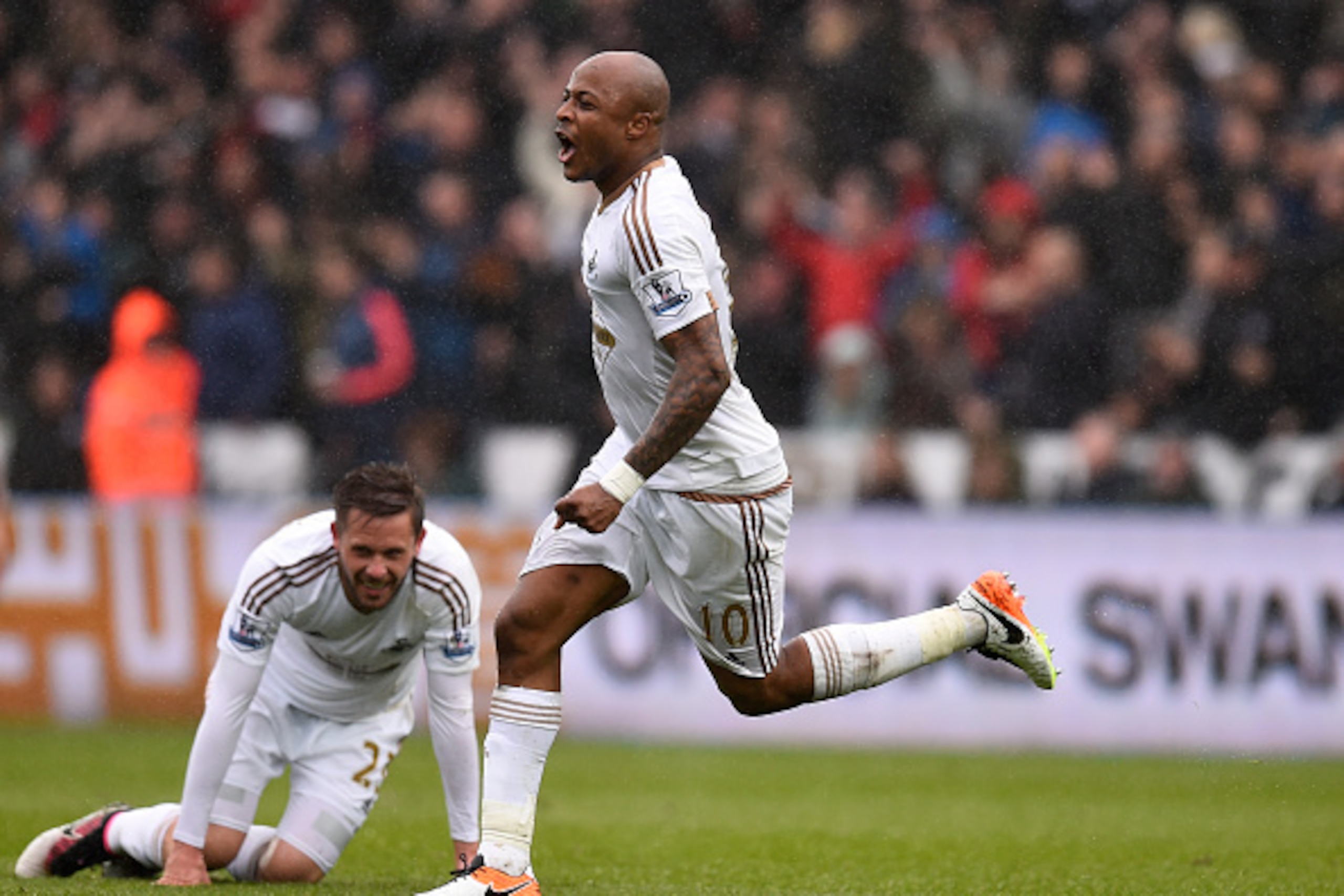 SWANSEA, WALES - MAY 01:  Andre Ayew of Swansea City celebrates scoring his team's third goal during the Barclays Premier League match between Swansea City and Liverpool at The Liberty Stadium on May 1, 2016 in Swansea, Wales.  (Photo by Stu Forster/Getty