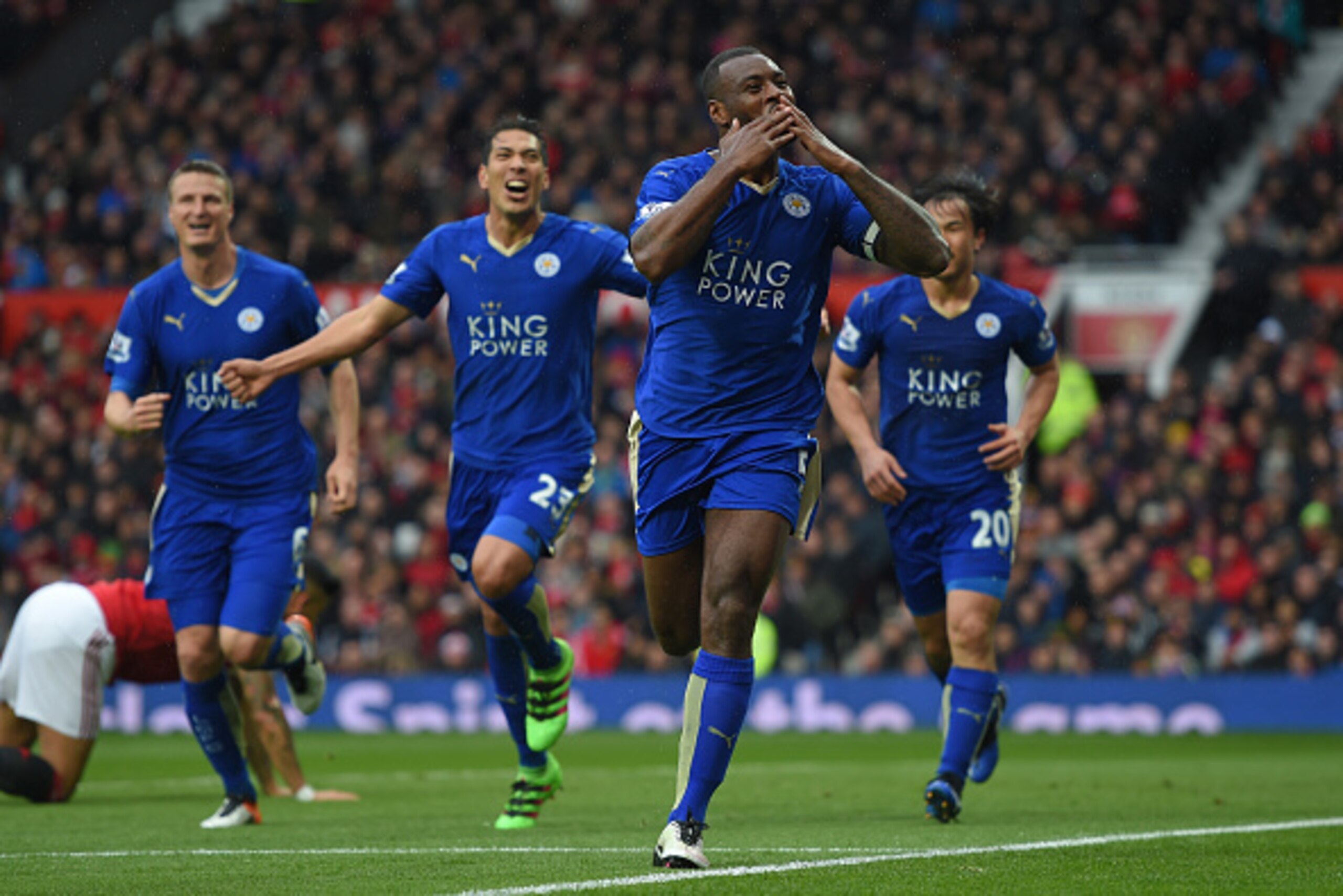 MANCHESTER, ENGLAND - MAY 01:  Wes Morgan of Leicester City celebrates scoring his team's opening goal with team mates during the Barclays Premier League match between Manchester United and Leicester City at Old Trafford on May 1, 2016 in Manchester, Engl