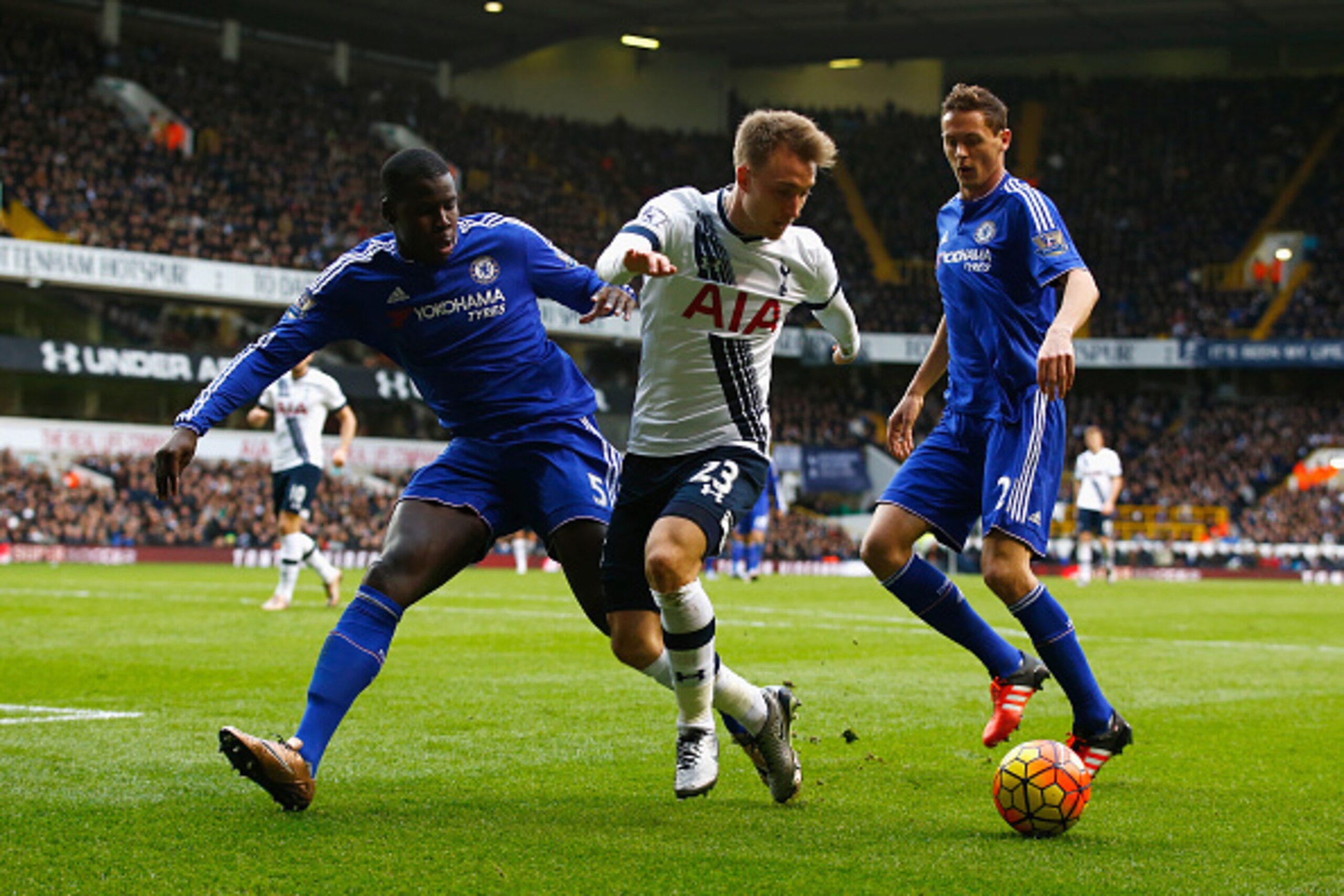 LONDON, ENGLAND - NOVEMBER 29:  Christian Eriksen of Tottenham Hotspur is marshalled by Kurt Zouma and Nemanja Matic of Chelsea during the Barclays Premier League match between Tottenham Hotspur and Chelsea at White Hart Lane on November 29, 2015 in Londo