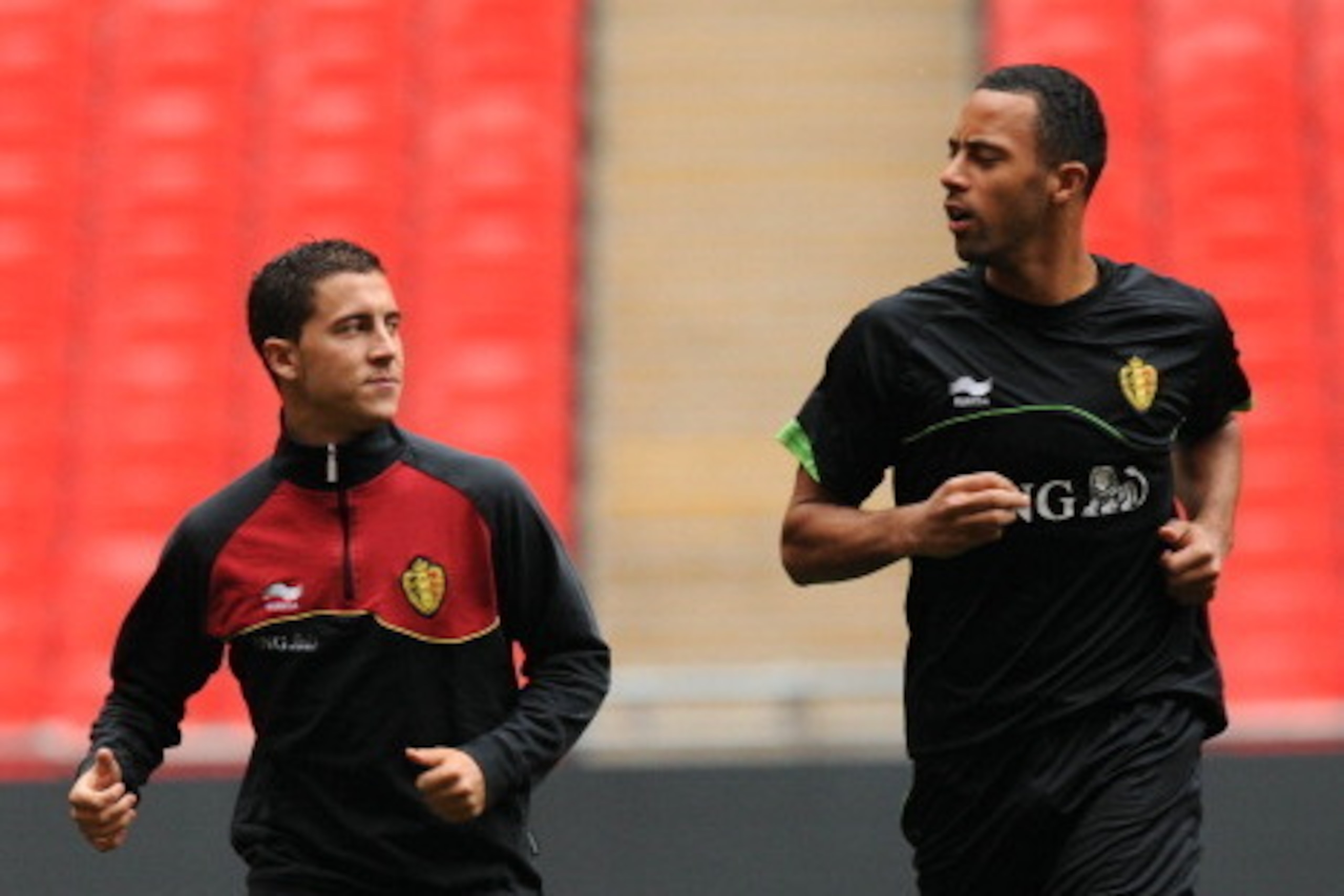Belgium's national football team's players Eden Hazard (L) and Moussa Dembele run during a training session at Wembley Stadium in Wembley, North London, on June 1, 2012  prior to their game with England on June 2.  AFP PHOTO/Olly Greenwood        (Photo c