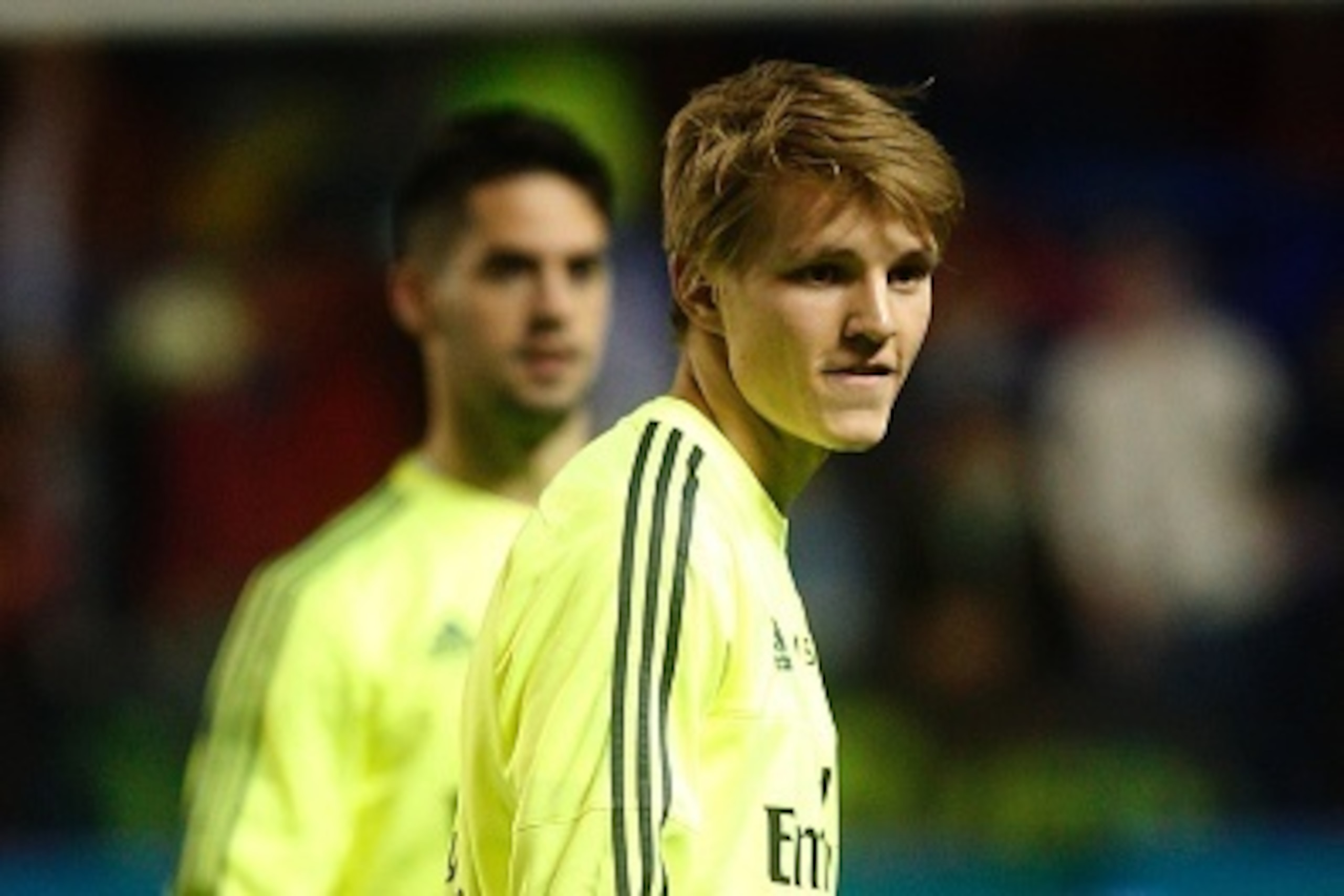 Real Madrid's Norwegian midfielder Martin Odegaard (R) warms up before the Spanish league football match Levante UD vs Real Madrid CF at the Ciutat de Valencia stadium in Valencia on March 2, 2016. / AFP / Jose Jordan        (Photo credit should read JOSE