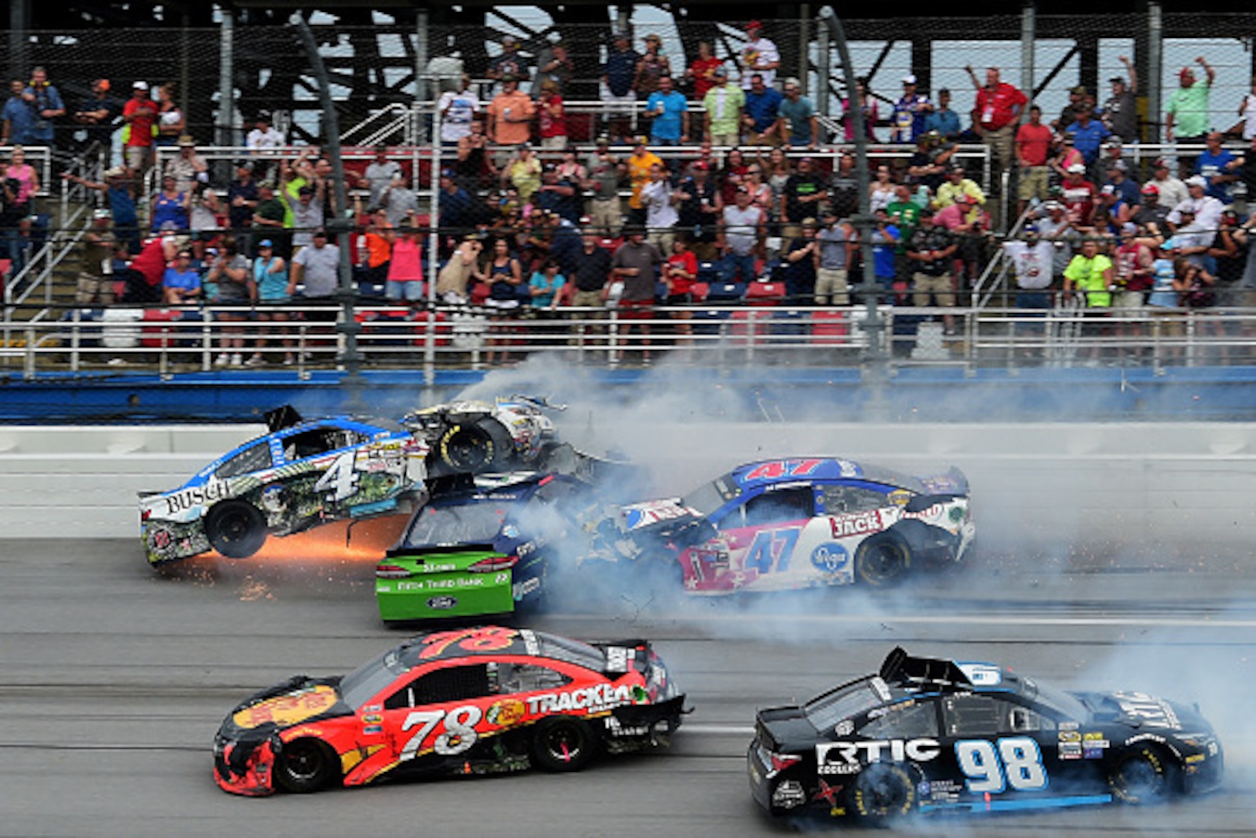 TALLADEGA, AL - MAY 01: Kevin Harvick, driver of the #4 Busch Fishing Chevrolet, Ricky Stenhouse Jr, driver of the #17 Fifth Third Bank Ford, and AJ Allmendinger, driver of the #47 Kroger/Hungry Jack/Crisco Chevrolet, are involved in an incident on the f TALLADEGA, AL - MAY 01: Kevin Harvick, driver of the #4 Busch Fishing Chevrolet, Ricky Stenhouse Jr, driver of the #17 Fifth Third Bank Ford, and AJ Allmendinger, driver of the #47 Kroger/Hungry Jack/Crisco Chevrolet, are involved in an incident on the f