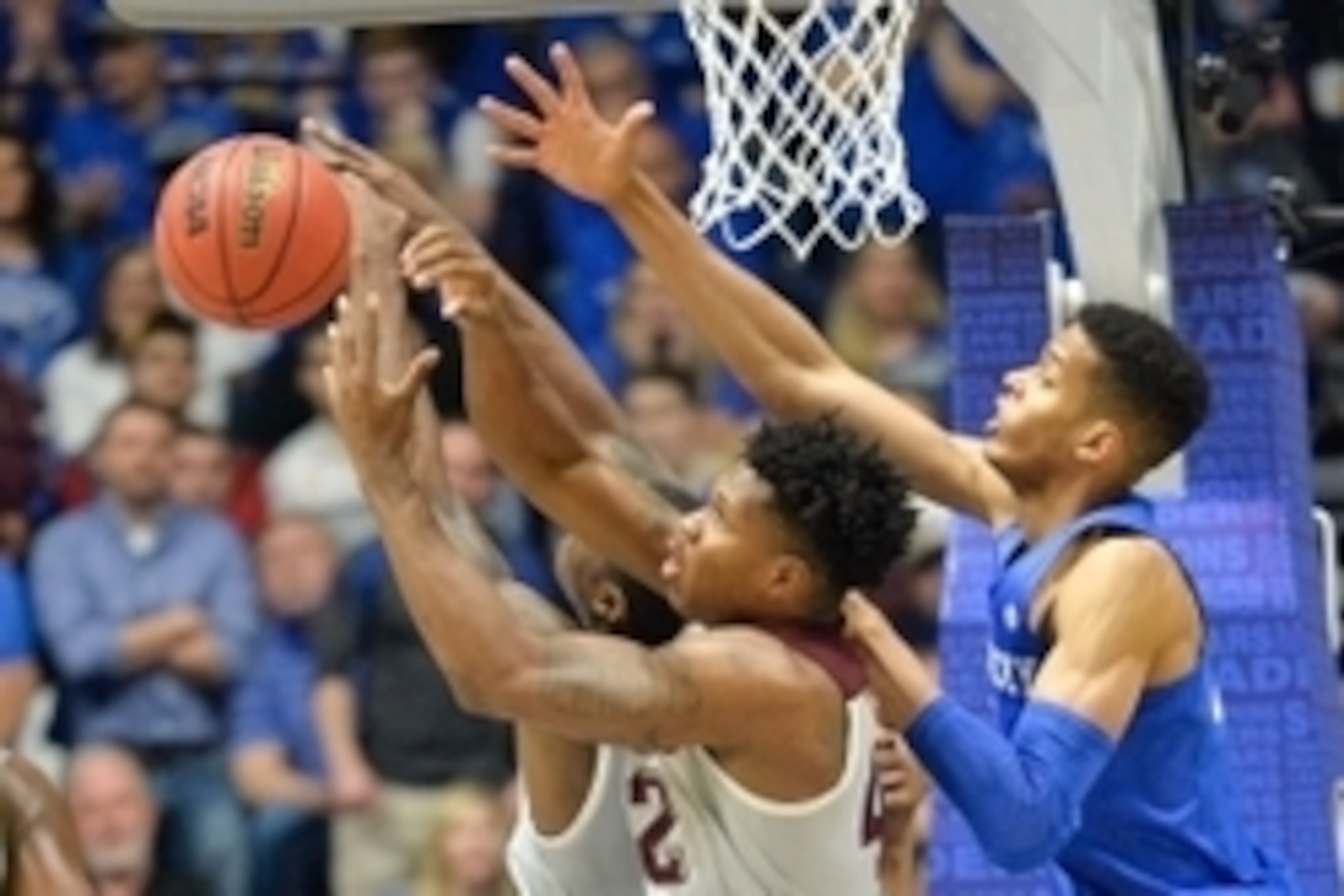 Mar 13, 2016; Nashville, TN, USA; Texas A&M Aggies guard Jalen Jones (12) and forward Tavario Miller (42) fight for possession with Kentucky Wildcats forward Skal Labissiere (1) during the first half of the championship game of the SEC tournament at Bridg