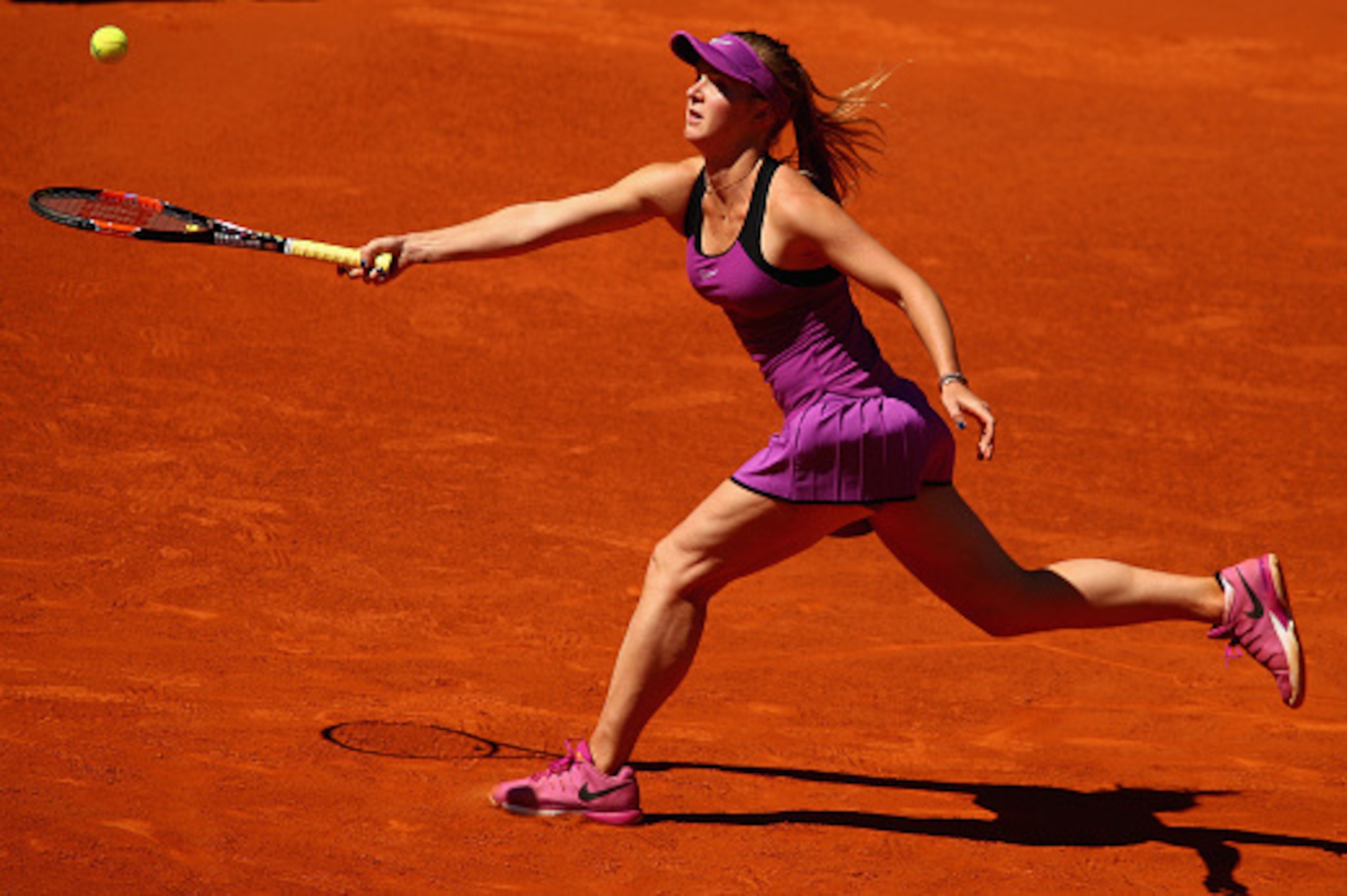 MADRID, SPAIN - APRIL 30:  Elina Svitolina of the Ukraine stretches for a forehand against Yanina Wickmayer of Belgium in their first round  match during day one of the Mutua Madrid Open tennis tournament at the Caja Magica on April 30, 2016 in Madrid, Sp
