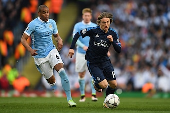 MANCHESTER, ENGLAND - APRIL 26:  Luka Modric of Real Madrid CF goes past Fernando of Manchester City during the UEFA Champions League Semi Final first leg match between Manchester City FC and Real Madrid at the Etihad Stadium on April 26, 2016 in Manchest