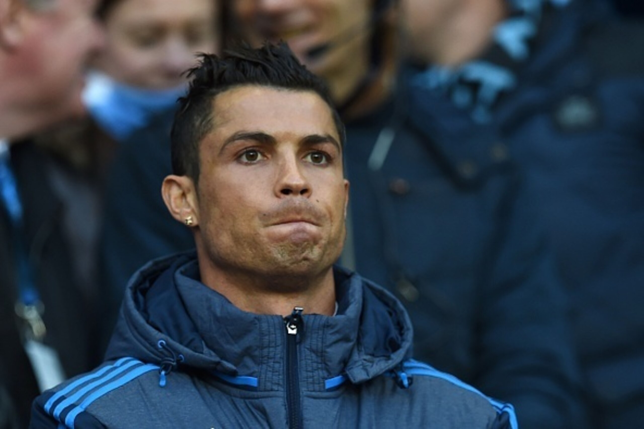 Real Madrid's Portuguese forward Cristiano Ronaldo watches from the crowd as a spectator during the UEFA Champions League semi-final first leg football match between Manchester City and Real Madrid at the Etihad Stadium in Manchester, northwest England, o