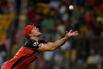 Royal Challengers Bangalore fielder Shane Watson attempts to take a catch to dismiss Delhi Daredevils batsman Shreyas Iyer (unseen), during the 2016 Indian Premier League (IPL) Twenty20 cricket match between Royal Challengers Bangalore and Delhi Dardevils