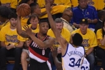 May 1, 2016; Oakland, CA, USA; Portland Trail Blazers guard Damian Lillard (0) passes the basketball against Golden State Warriors guard Shaun Livingston (34) during the first quarter in game one of the second round of the NBA Playoffs at Oracle Arena. Ma