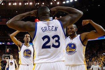OAKLAND, CA - APRIL 27:  Draymond Green #23 of the Golden State Warriors is congratulated by Shaun Livingston #34 and Andre Iguodala #9 after he made a shot on Dwight Howard #12 of the Houston Rockets in Game Five of the Western Conference Quarterfinals d