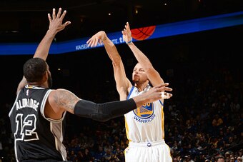 OAKLAND, CA  - APRIL 7: Stephen Curry #30 of the Golden State Warriors shoots against the San Antonio Spurs during the game on April 7, 2016 at ORACLE Arena in Oakland, California. NOTE TO USER: User expressly acknowledges and agrees that, by downloading 