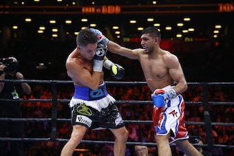 NEW YORK, NY - MAY 29:  Amir Khan punches Chris Algieri during their Welterweight bout at Barclays Center of Brooklyn on May 29, 2015 in New York City.  (Photo by Al Bello/Getty Images)
