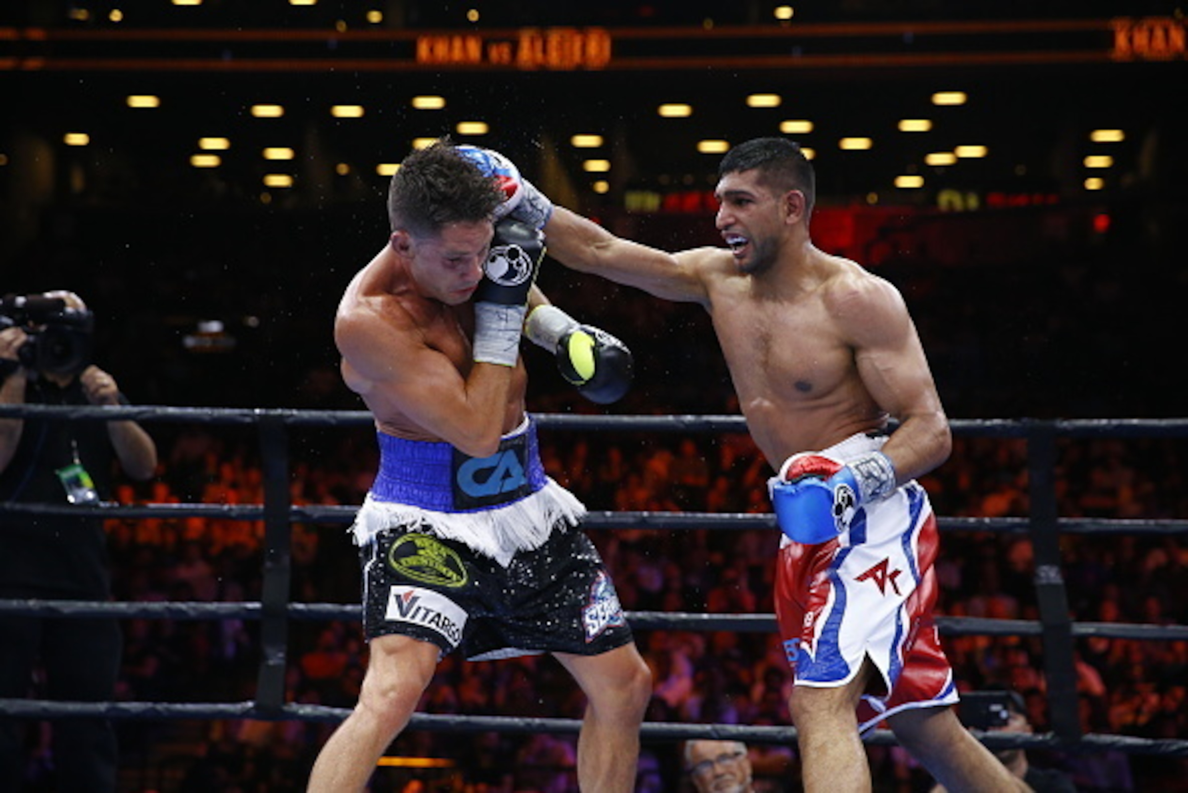 NEW YORK, NY - MAY 29:  Amir Khan punches Chris Algieri during their Welterweight bout at Barclays Center of Brooklyn on May 29, 2015 in New York City.  (Photo by Al Bello/Getty Images)