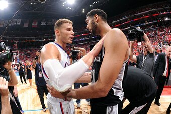 LOS ANGELES, CA - MAY 2: Blake Griffin #32 of the Los Angeles Clippers and Tim Duncan #21 of the San Antonio Spurs hug after Game Seven of the Western Conference Quarterfinals during the 2015 NBA Playoffs on May  2, 2015 at STAPLES Center in Los Angeles, 