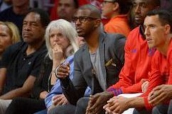 Apr 27, 2016; Los Angeles, CA, USA; Los Angeles Clippers guard Chris Paul (3) sits on the bench with his arm in a cast during the first quarter of game five of the first round of the NBA Playoffs against the Portland Trail Blazers at Staples Center. At th