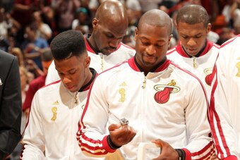 MIAMI, FL - OCTOBER 29: Dwyane Wade #3 of the Miami Heat admires his ring during the ceremony before the game against the Chicago Bulls on October 29, 2013 at American Airlines Arena in Miami, Florida. NOTE TO USER: User expressly acknowledges and agrees 