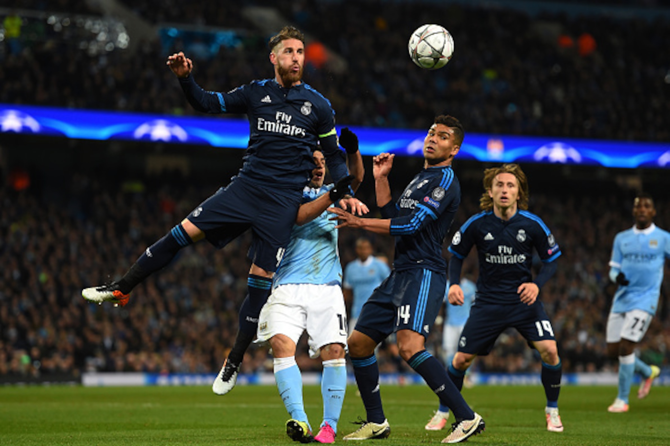 MANCHESTER, ENGLAND - APRIL 26:  Sergio Ramos of Real Madrid CF rises above Sergio Aguero of Manchester City to head the ball clear during the UEFA Champions League Semi Final first leg match between Manchester City FC and Real Madrid at the Etihad Stadiu