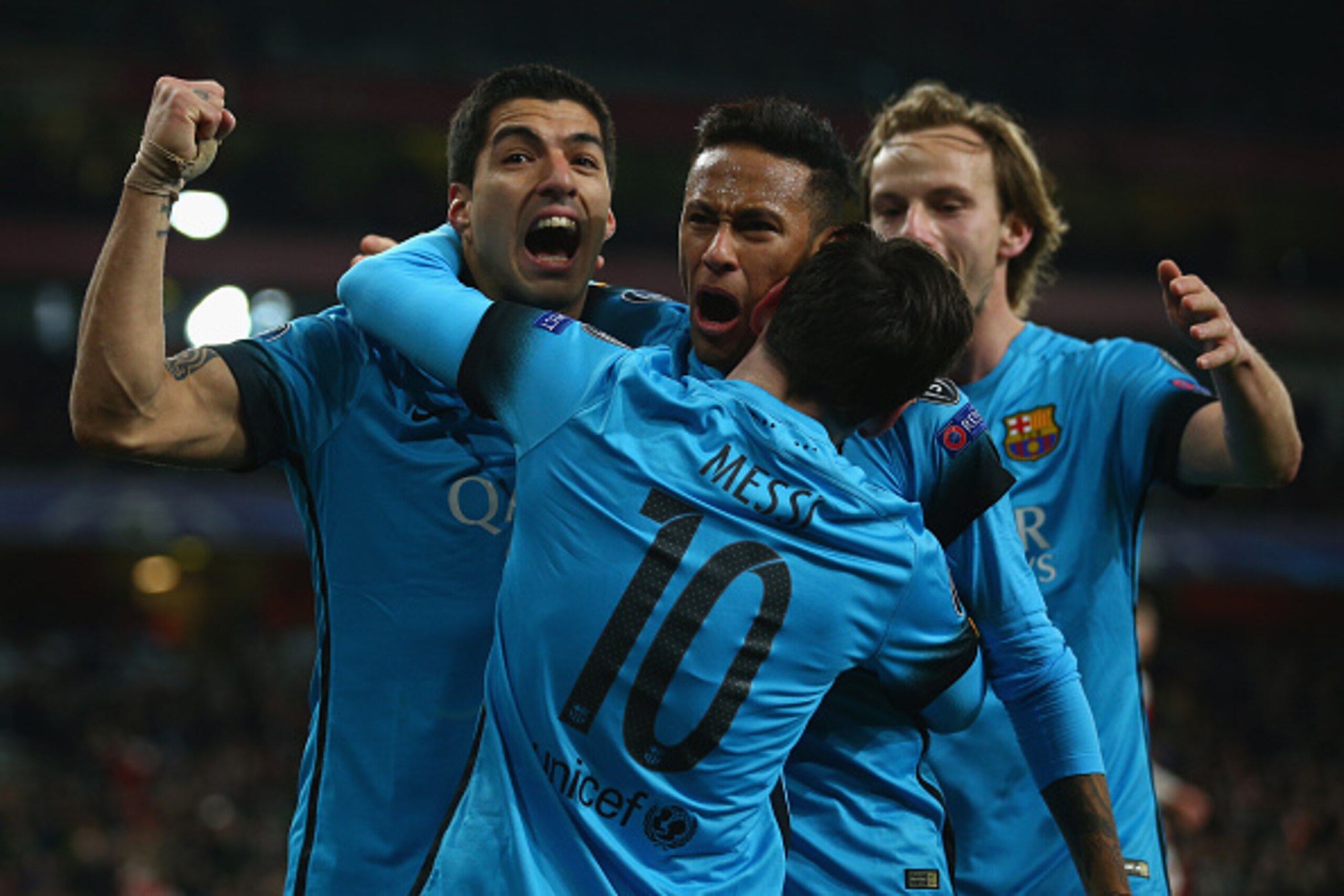 LONDON, ENGLAND - FEBRUARY 23:  Lionel Messi of Barcelona celebrates with Luis Suarez and Neymar of Barcelona after scoring the first goal during the UEFA Champions League round of 16 first leg match between Arsenal and Barcelona on February 23, 2016 in L