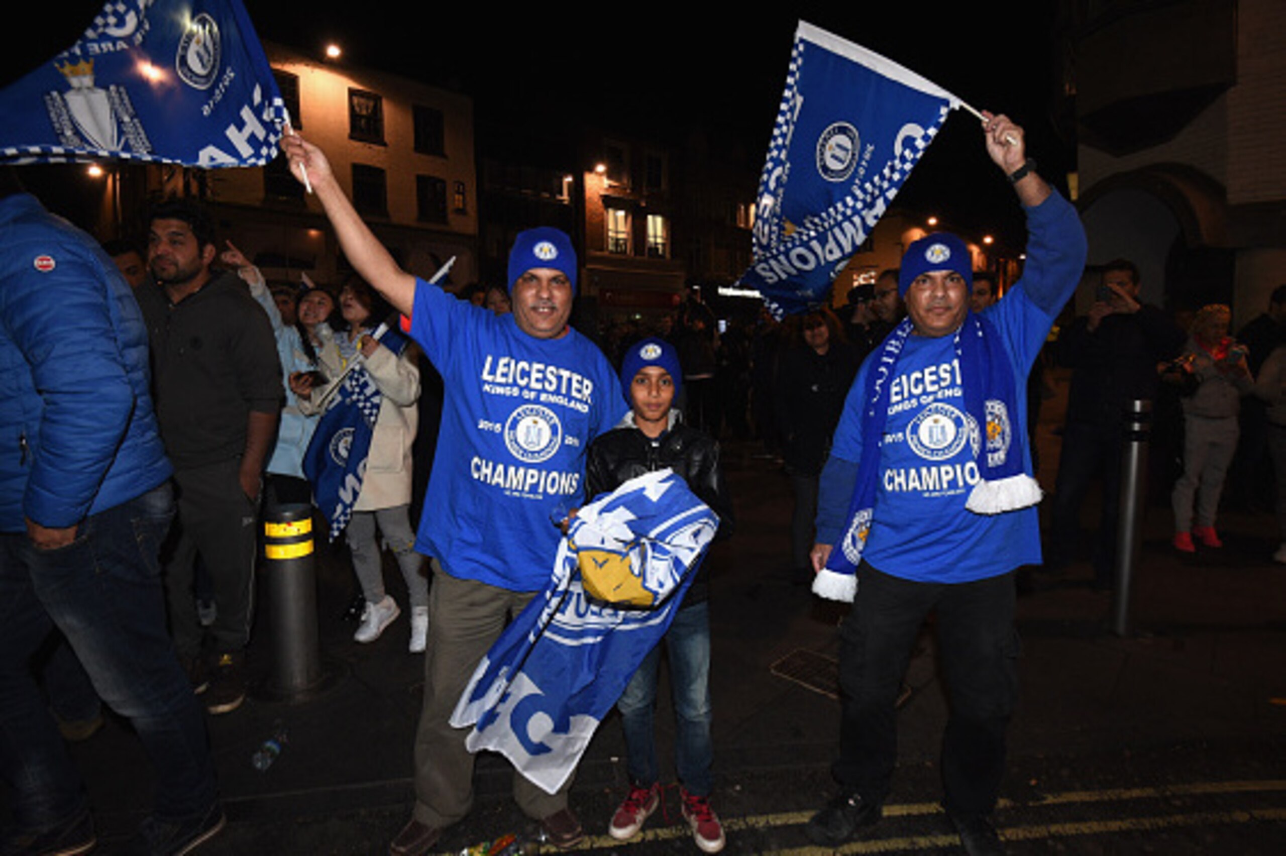 LEICESTER, UNITED KINGDOM - MAY 02:  Leicester City fans celebrate as their team becomes Premier League champions after watching the Barclays Premier League between Chelsea and Tottenham Hotspur on May 2, 2016 in Leicester, United Kingdom. Spurs' failure 