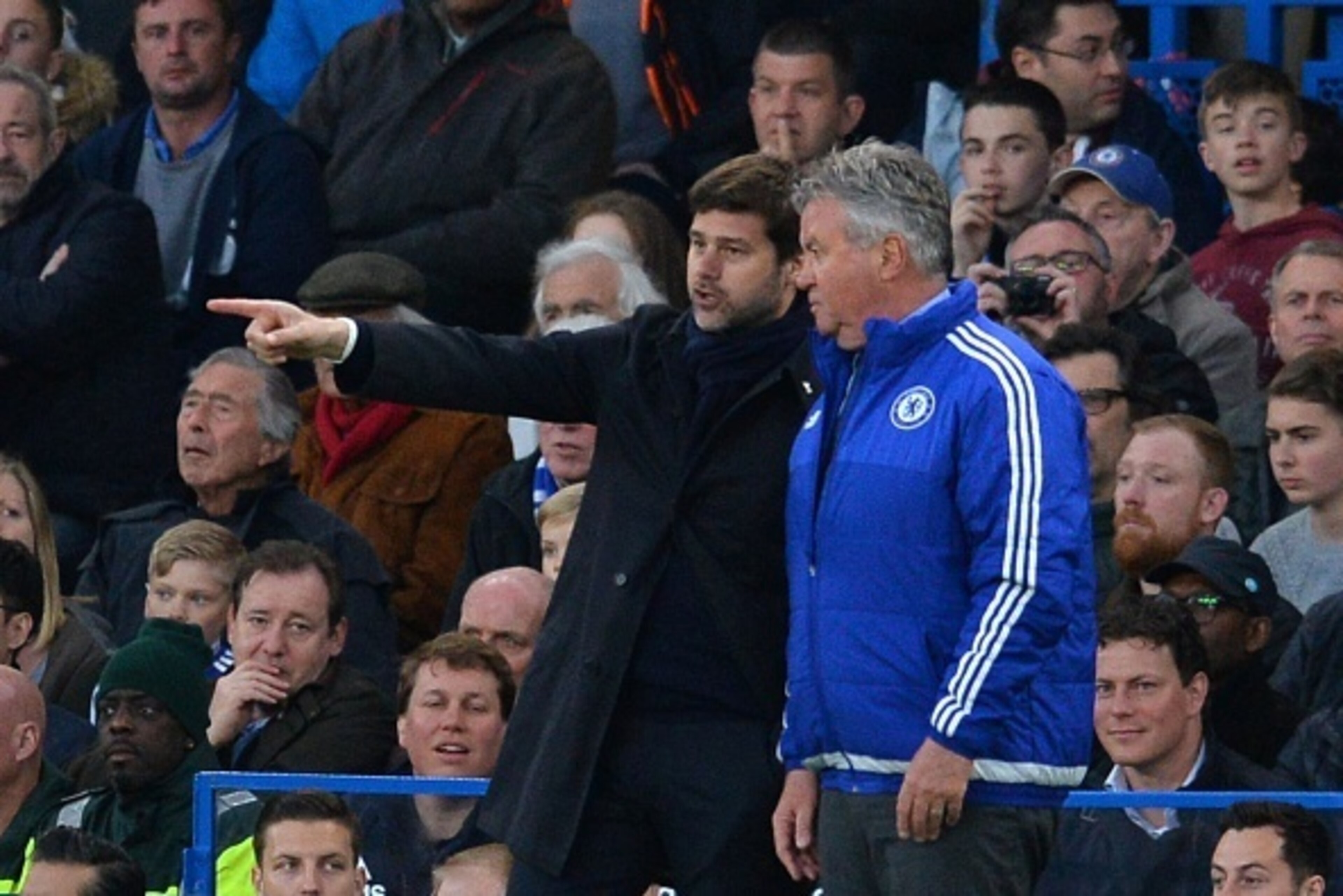 Tottenham Hotspur's Argentinian head coach Mauricio Pochettino (L) talks with Chelsea's Dutch interim manager Guus Hiddink (R) on the touchlinen during the English Premier League football match between Chelsea and Tottenham Hotspur at Stamford Bridge in L Tottenham Hotspur's Argentinian head coach Mauricio Pochettino (L) talks with Chelsea's Dutch interim manager Guus Hiddink (R) on the touchlinen during the English Premier League football match between Chelsea and Tottenham Hotspur at Stamford Bridge in L