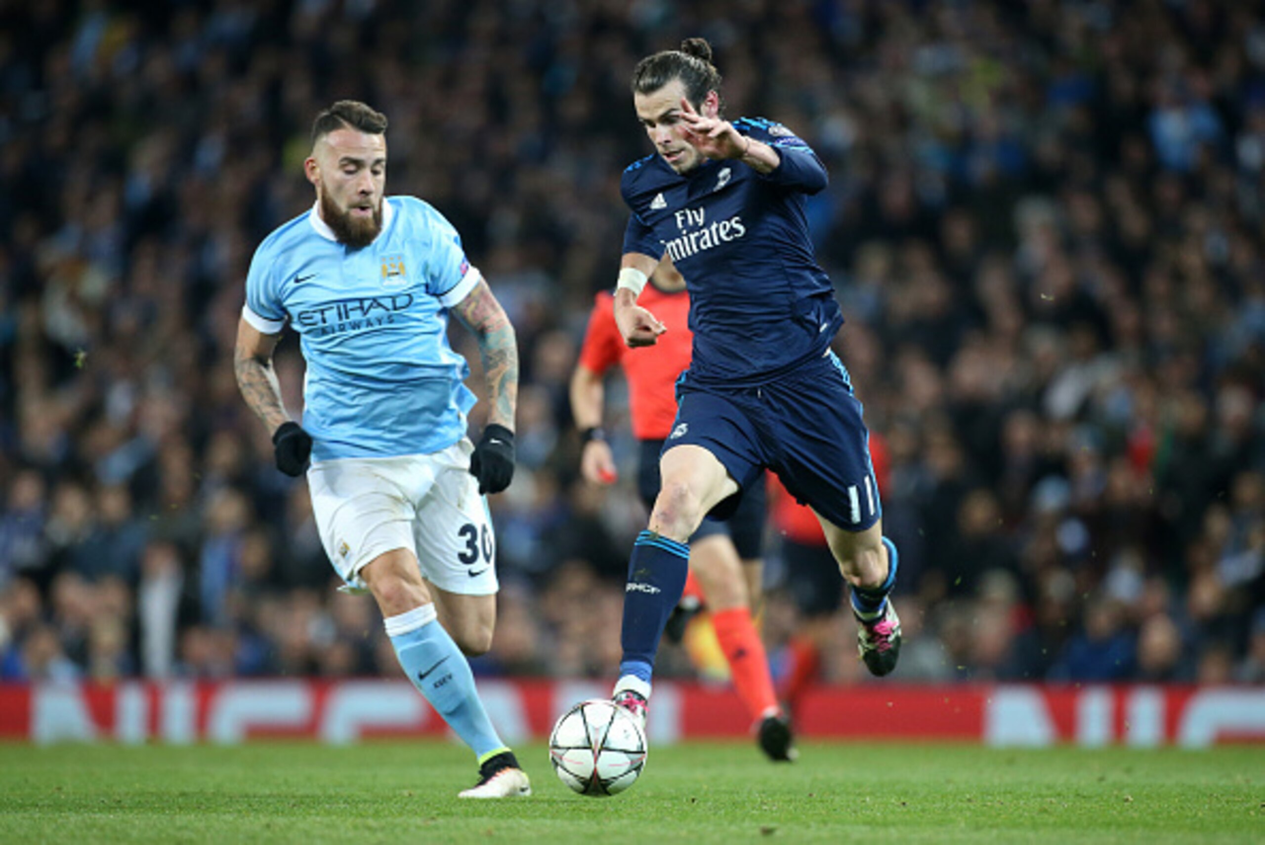 MANCHESTER, ENGLAND - APRIL 26: Gareth Bale of Real Madrid and Nicolas Otamendi of Manchester City (left) in action during the UEFA Champions League semi final first leg match between Manchester City FC and Real Madrid at Etihad Stadium on April 26, 2016 