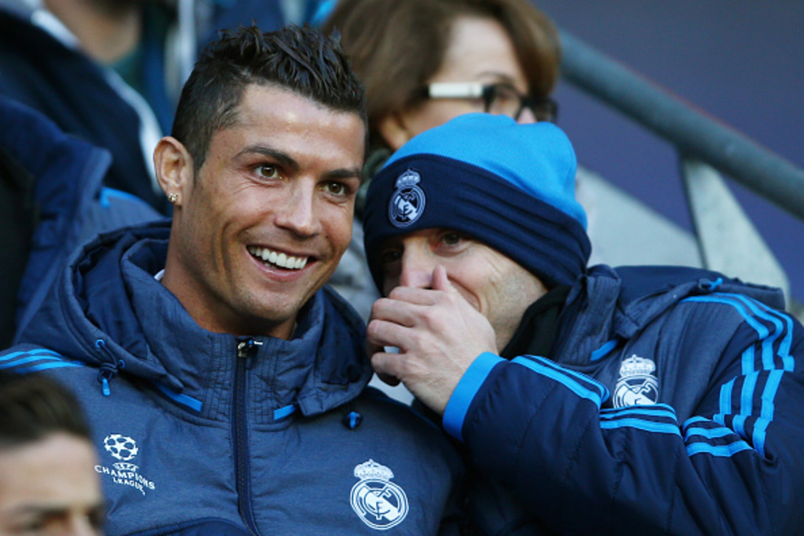 MANCHESTER, ENGLAND - APRIL 26:  The non playing Cristiano Ronaldo of Real Madrid CF shares a joke with a teammate during the UEFA Champions League Semi Final first leg match between Manchester City FC and Real Madrid at the Etihad Stadium on April 26, 20