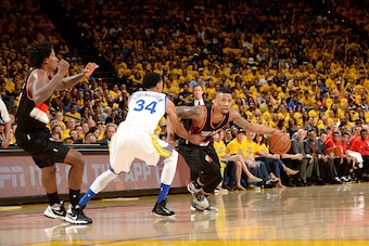 OAKLAND, CA - MAY 1: Damian Lillard #0 of the Portland Trail Blazers handles the ball during the game against Shaun Livingston #34 of the Golden State Warriors in Game One of the Western Conference Semifinals during the 2016 NBA Playoffs on May 1, 2016 at