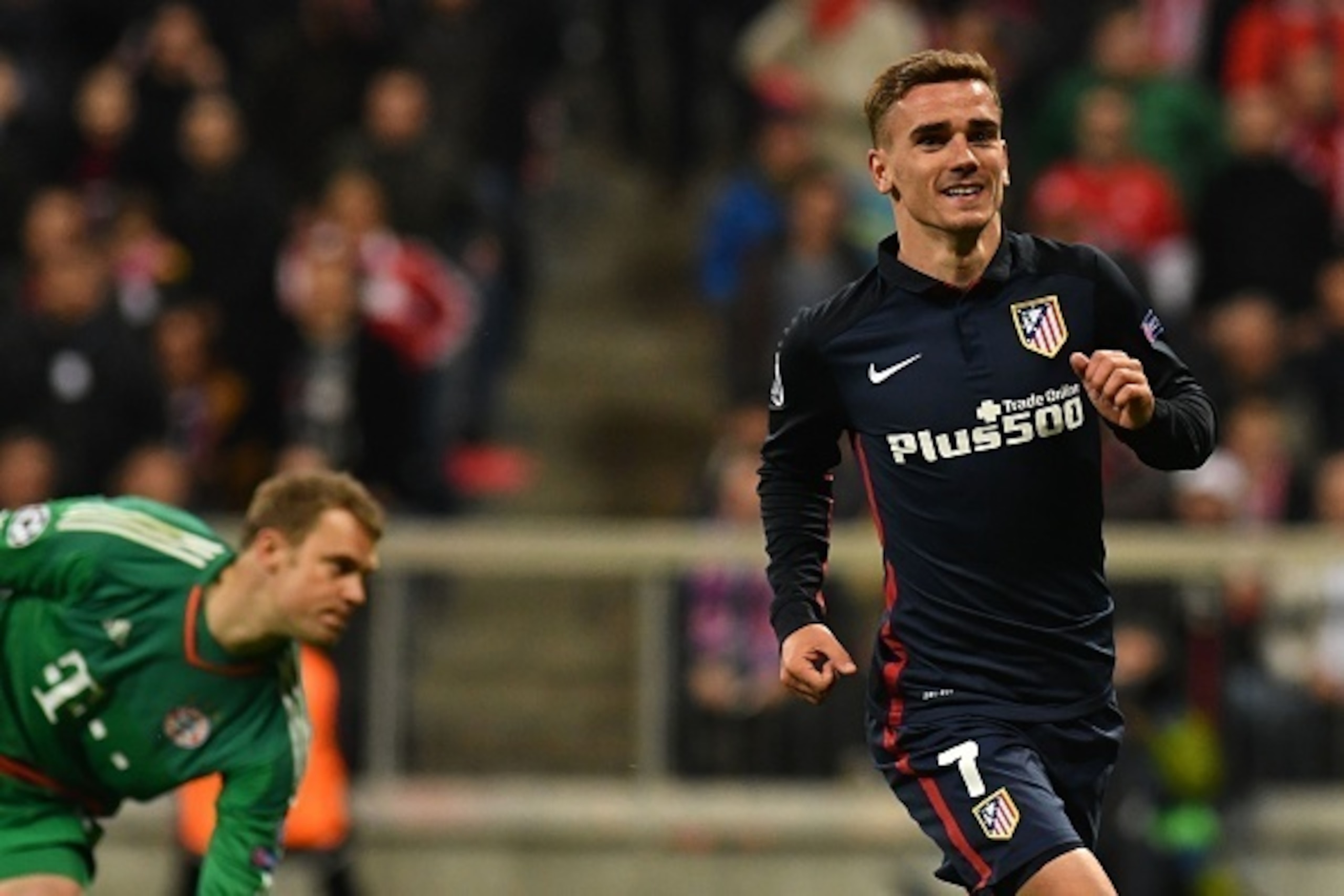 Atletico Madrid's French forward Antoine Griezmann celebrates scoring PAST Bayern Munich's goalkeeper Manuel Neuer (l) during the UEFA Champions League semi-final, second-leg football match between FC Bayern Munich and Atletico Madrid in Munich, southern Atletico Madrid's French forward Antoine Griezmann celebrates scoring PAST Bayern Munich's goalkeeper Manuel Neuer (l) during the UEFA Champions League semi-final, second-leg football match between FC Bayern Munich and Atletico Madrid in Munich, southern