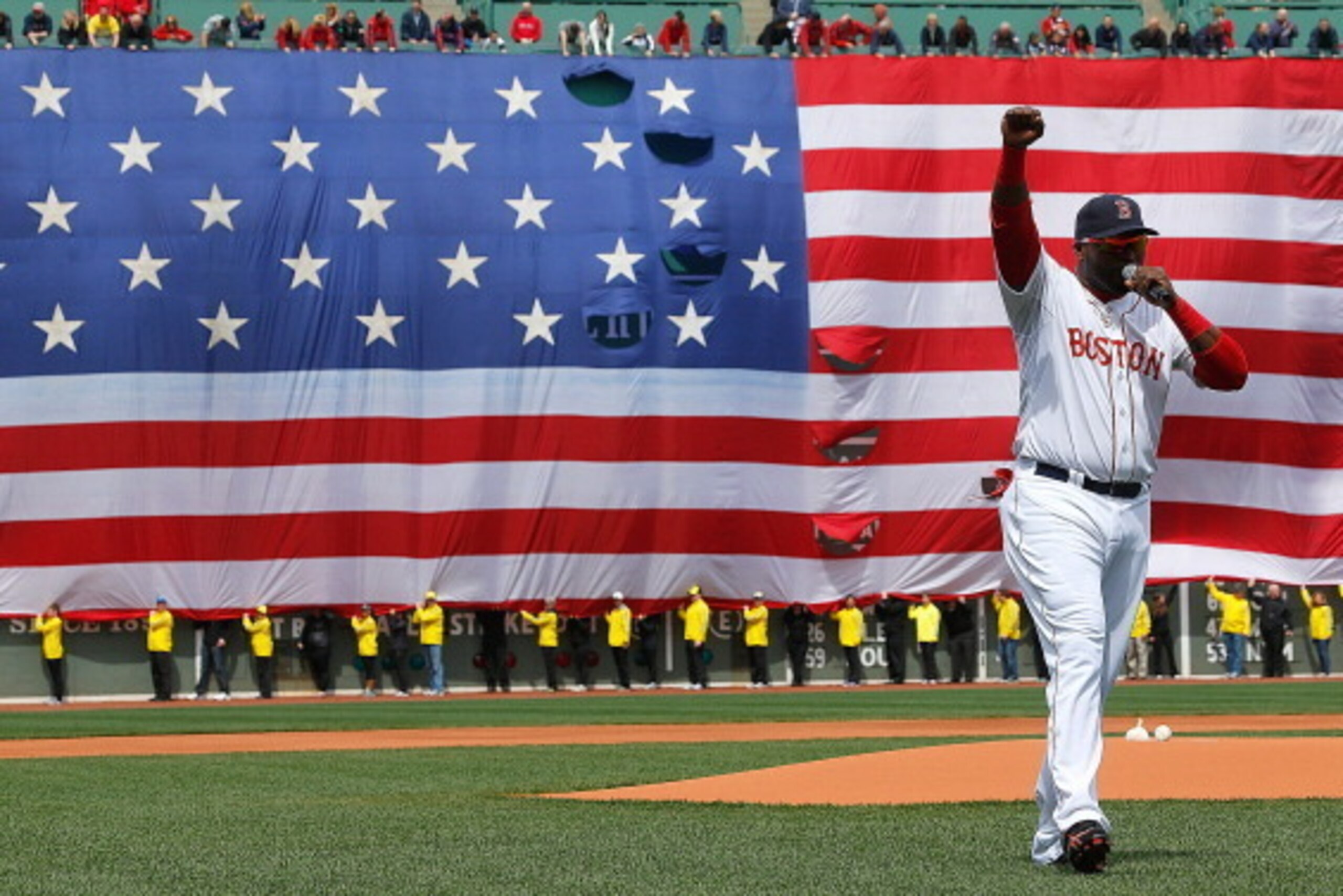 BOSTON, MA - APRIL 20:  David Ortiz #34 of the Boston Red Sox speaks during a pre-game ceremony in honor of the bombings of Marathon Monday before a game at Fenway Park on April 20, 2013 in Boston, Massachusetts.  (Photo by Jim Rogash/Getty Images)