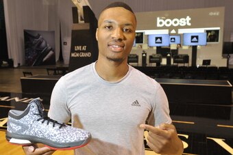 LAS VEGAS, NV - JULY 27: Damian Lillard of the Portland Trail Blazers unveils the new Crazy Light Boost at the adidas BOOST Basketball Launch inside the MGM Grand Garden Arena in Las Vegas on July 27, 2014 in Las Vegas, Nevada. (Photo by David Becker/Gett