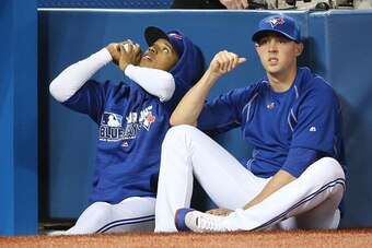 TORONTO, CANADA - APRIL 9: Marcus Stroman #6 of the Toronto Blue Jays and Aaron Sanchez #41 look on from the top step of the dugout during MLB game action against the Boston Red Sox on April 9, 2016 at Rogers Centre in Toronto, Ontario, Canada. (Photo by 