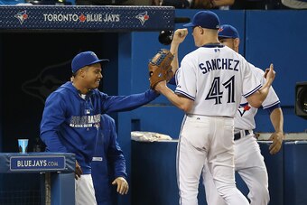 TORONTO, CANADA - JUNE 5: Aaron Sanchez #41 of the Toronto Blue Jays is congratulated by Marcus Stroman #6 as he exits the game in the ninth inning during MLB game action against the Houston Astros on June 5, 2015 at Rogers Centre in Toronto, Ontario, Can