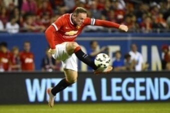 Jul 29, 2015; Chicago, IL, USA; Manchester United forward Wayne Rooney (10) kicks the ball against the Paris Saint-Germain during the second half at Soldier Field. Paris Saint-Germain defeats Manchester United 2-0. Mandatory Credit: Mike DiNovo-USA TODAY 