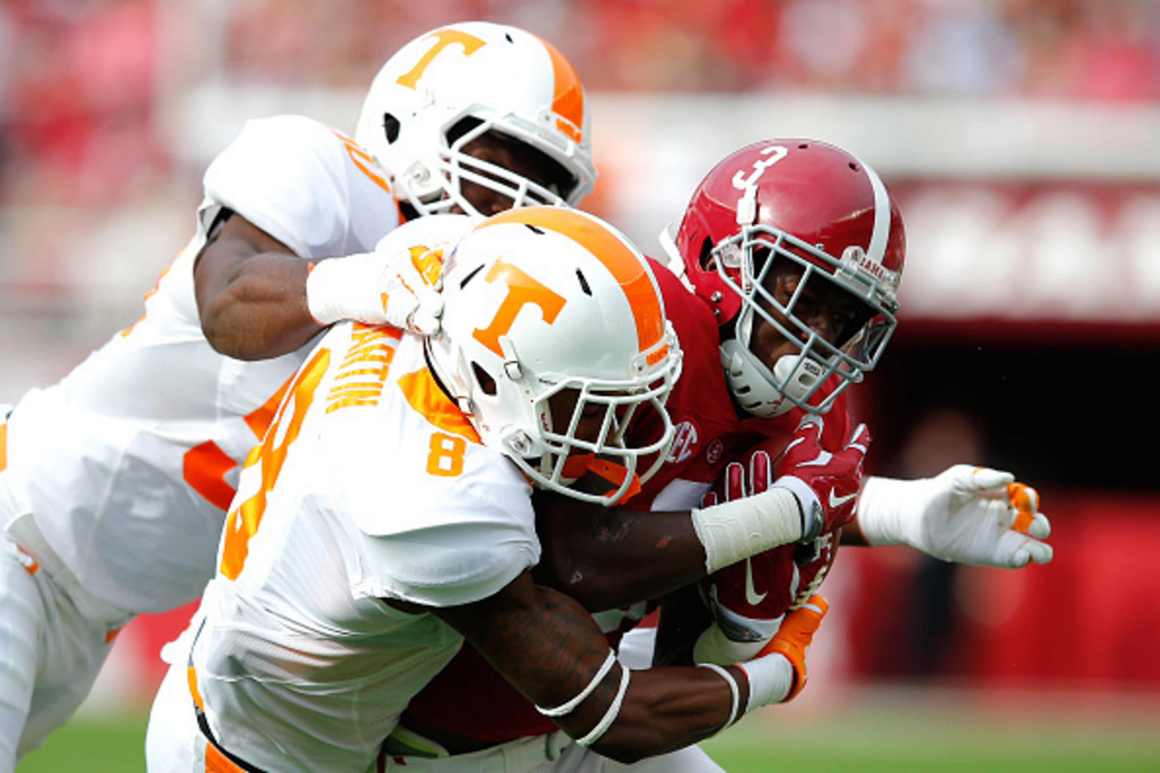 TUSCALOOSA, AL - OCTOBER 24:  Calvin Ridley #3 of the Alabama Crimson Tide is tackled by Justin Martin #8 and Corey Vereen #50 of the Tennessee Volunteers at Bryant-Denny Stadium on October 24, 2015 in Tuscaloosa, Alabama.  (Photo by Kevin C. Cox/Getty Im