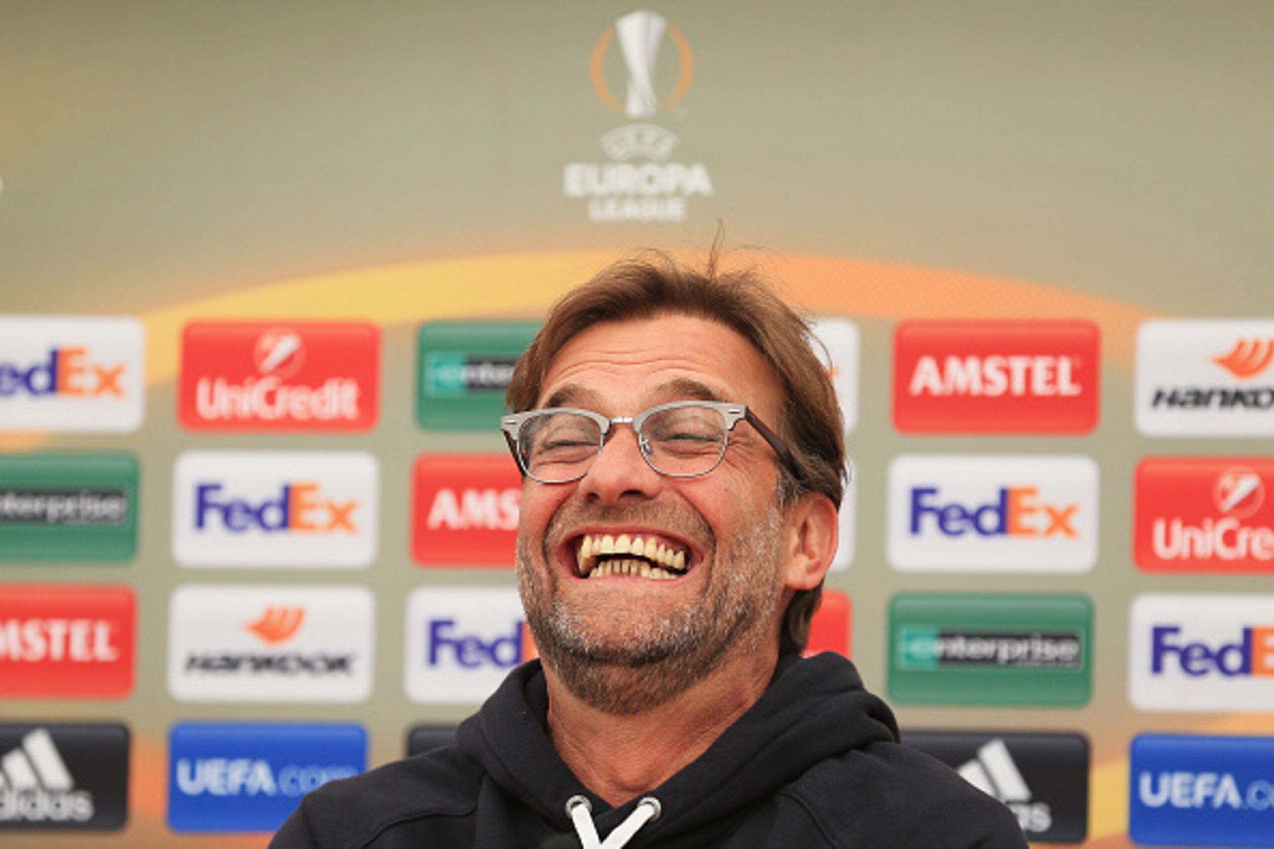 LIVERPOOL, ENGLAND - MAY 04:  Jurgen Klopp, manager of Liverpool laughs during a press conference ahead of the UEFA Europa League Semi-Final Second Leg match against Villarreal at Melwood Training Ground on May 4, 2016 in Liverpool, England.  (Photo by Cl