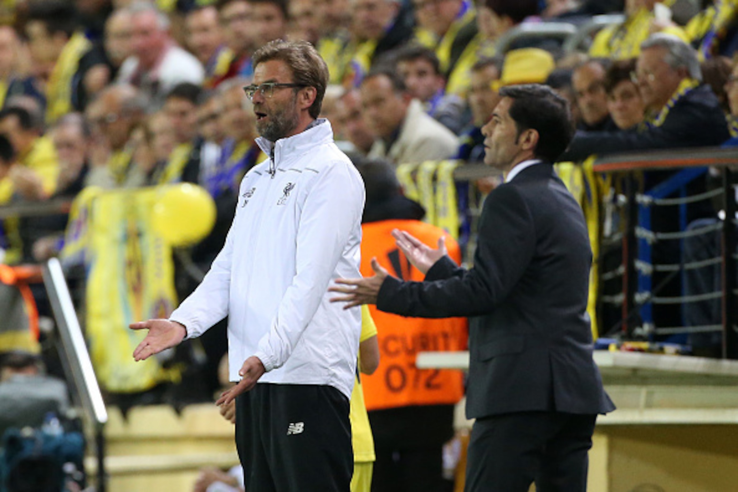 VILLARREAL, SPAIN - APRIL 28: Coach of Liverpool Jurgen Klopp and coach of Villarreal Marcelino Garcia Toral gesture during the UEFA Europa League semi final first leg match between Villarreal CF and Liverpool FC at Estadio El Madrigal stadium on April 28