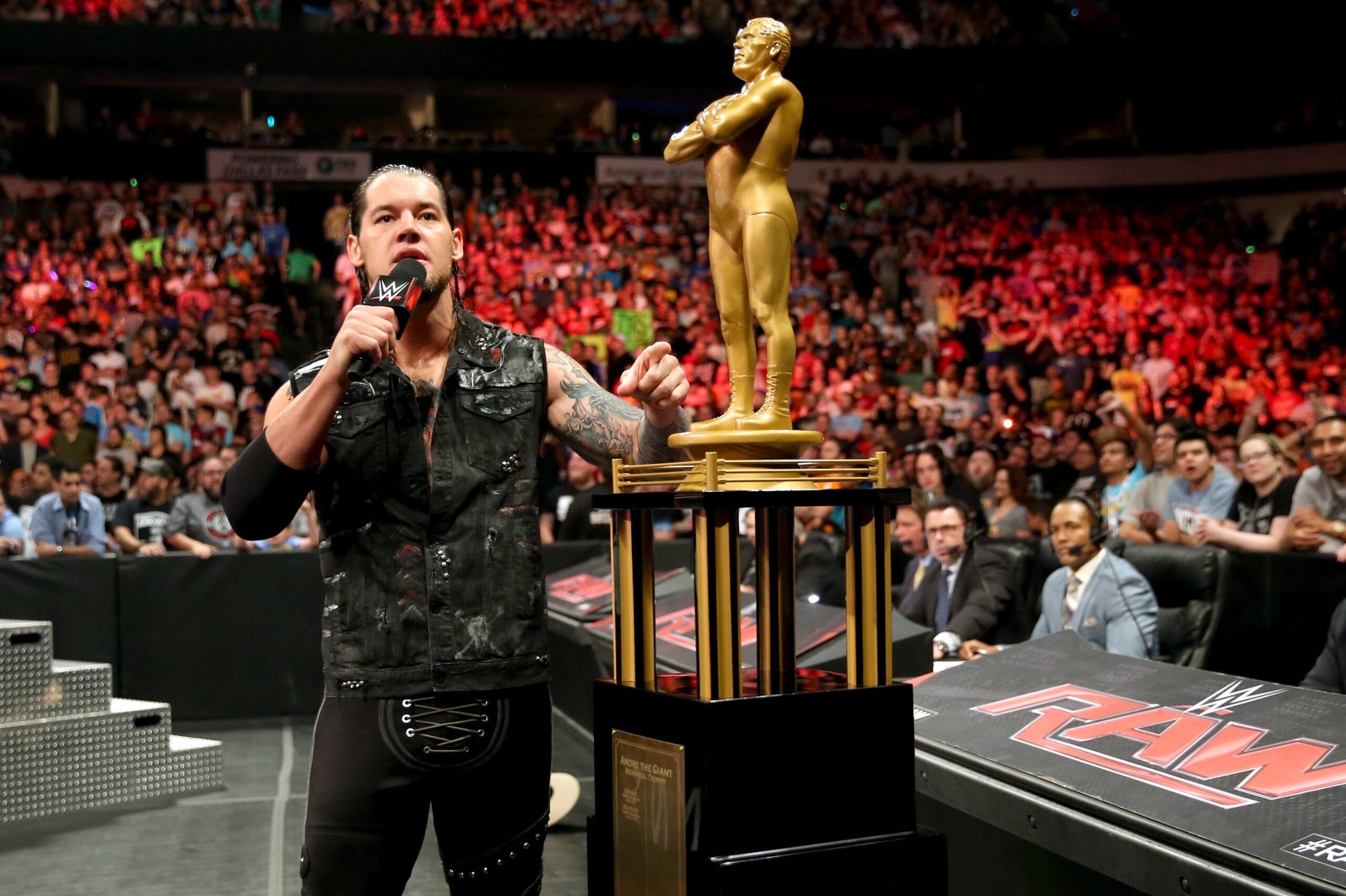 Baron Corbin stands with his Battle Royal trophy.