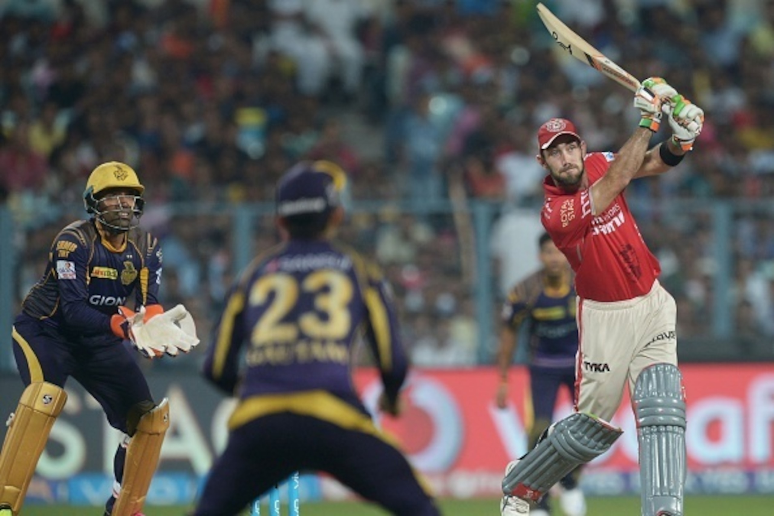Kings XI Punjab Glenn Maxwell (R) is watched by Kolkata Knight Riders captain Gautam Gambhir (C) and Robin Uthappa as he plays a shot during the 2016 Indian Premier League (IPL) Twenty20 cricket match between Kolkata Knight Riders and Kings XI Punjab at t Kings XI Punjab Glenn Maxwell (R) is watched by Kolkata Knight Riders captain Gautam Gambhir (C) and Robin Uthappa as he plays a shot during the 2016 Indian Premier League (IPL) Twenty20 cricket match between Kolkata Knight Riders and Kings XI Punjab at t