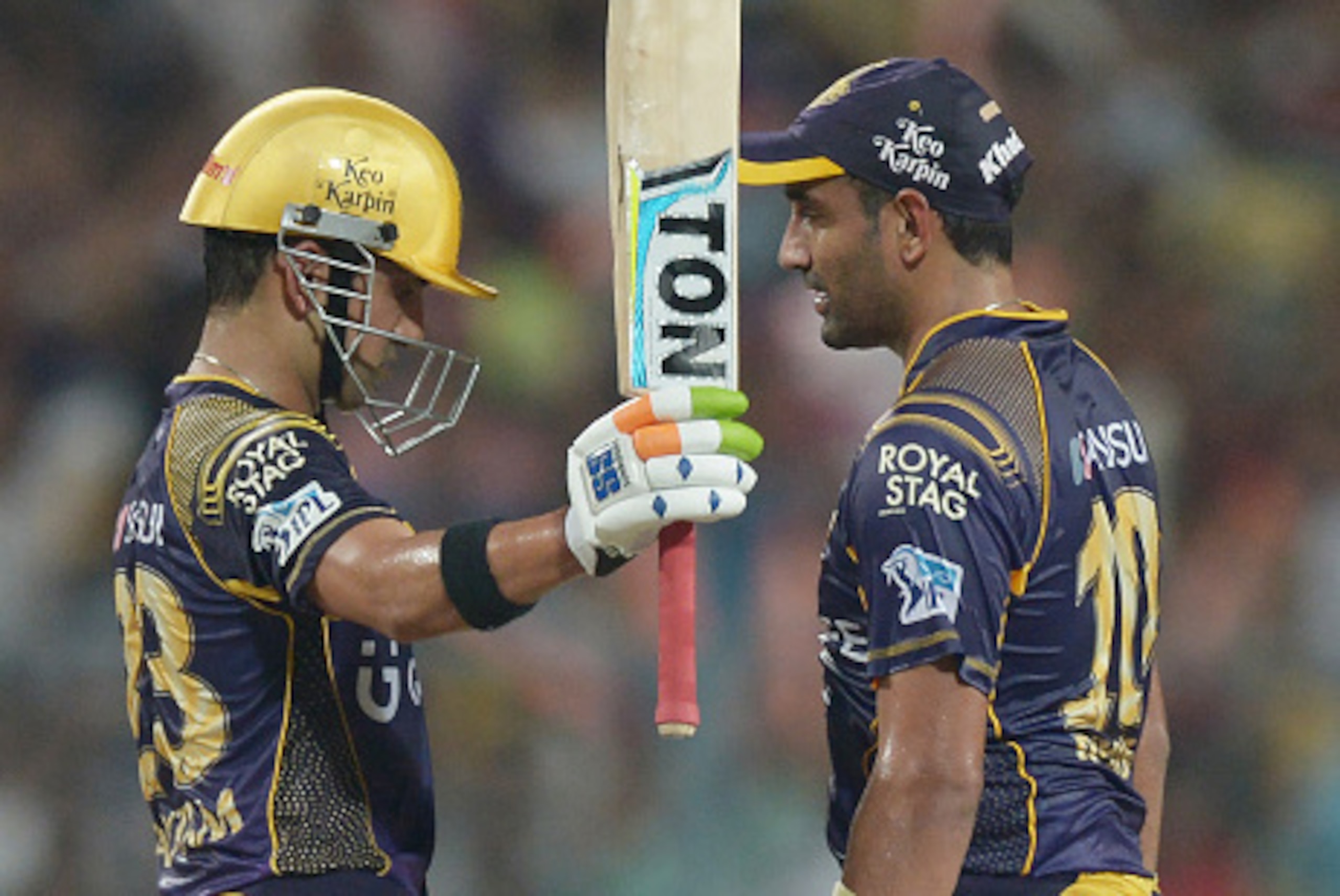 Kolkata Knight Riders captain Gautam Gambhir(L) celebrates after scoring a half-century (50 runs) as teammate Robin Uthappa looks on during the 2016 Indian Premier League(IPL) Twenty20 cricket match between Kolkata Knight Riders and Kings XI Punjab at The