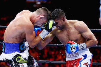 NEW YORK, NY - MAY 29:  Amir Khan punches Chris Algieri during their Welterweight bout at Barclays Center of Brooklyn on May 29, 2015 in New York City.  (Photo by Al Bello/Getty Images)