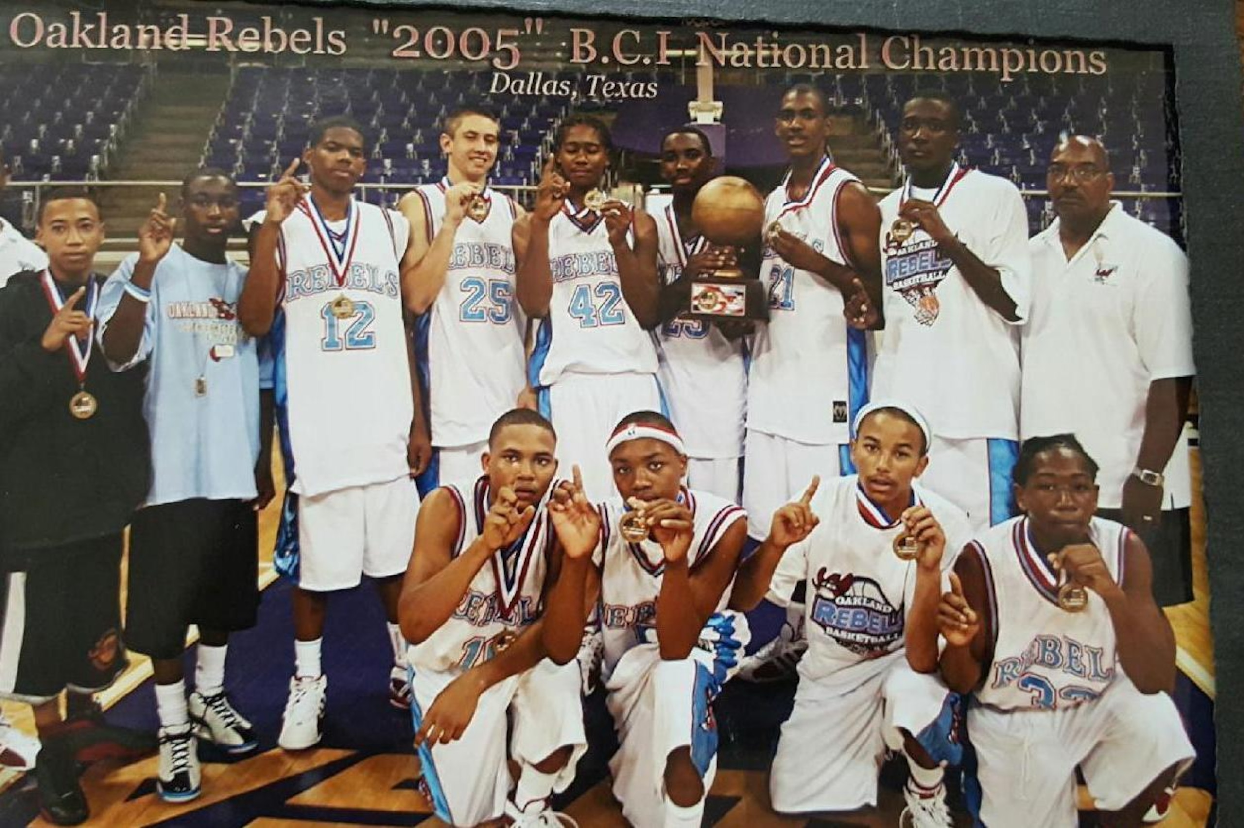 Lillard (first row, second from left) poses with his AAU team. Lillard (first row, second from left) poses with his AAU team.