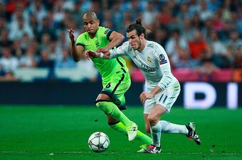 MADRID, SPAIN - MAY 04: Fernando of Manchester City chases down Gareth Bale of Real Madrid during the UEFA Champions League semi final, second leg match between Real Madrid and Manchester City FC at Estadio Santiago Bernabeu on May 4, 2016 in Madrid, Spai