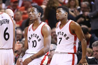 TORONTO, CANADA - APRIL 16: Kyle Lowry #7 (R) of the Toronto Raptors and DeMar DeRozan #10 (L) look on against the Indiana Pacers in Game One of the Eastern Conference Quarterfinals during the 2016 NBA Playoffs on April 16, 2016 at the Air Canada Centre i