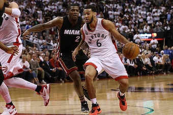 TORONTO, CAN - MAY 3: Cory Joseph #6 of the Toronto Raptors drives to the basket past Joe Johnson #2 of the Miami Heat during Game One of the NBA Eastern Conference Semi Finals at Air Canada Centre on May 3, 2016 in Toronto, Ontario, Canada. NOTE TO USER: