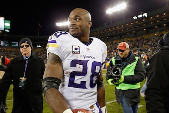 GREEN BAY, WI - JANUARY 03:  Adrian Peterson #28 of the Minnesota Vikings reacts after defeating the Green Bay Packers with a score of 20 to 13 at Lambeau Field on January 3, 2016 in Green Bay, Wisconsin.  (Photo by Wesley Hitt/Getty Images)