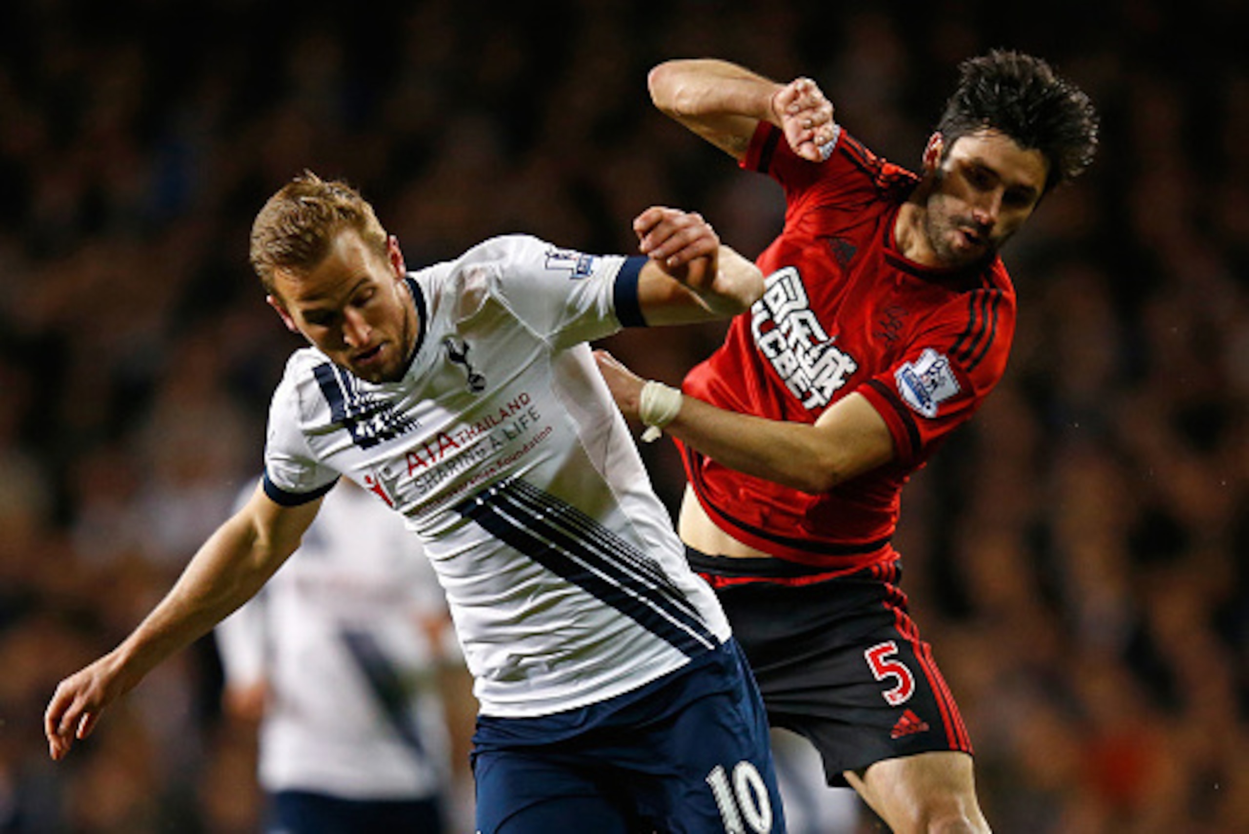 LONDON, ENGLAND - APRIL 25:  Harry Kane of Tottenham Hotspur is challenged by Claudio Yacob of West Bromwich Albion during the Barclays Premier League match between Tottenham Hotspur and West Bromwich Albion at White Hart Lane on April 25, 2016 in London,